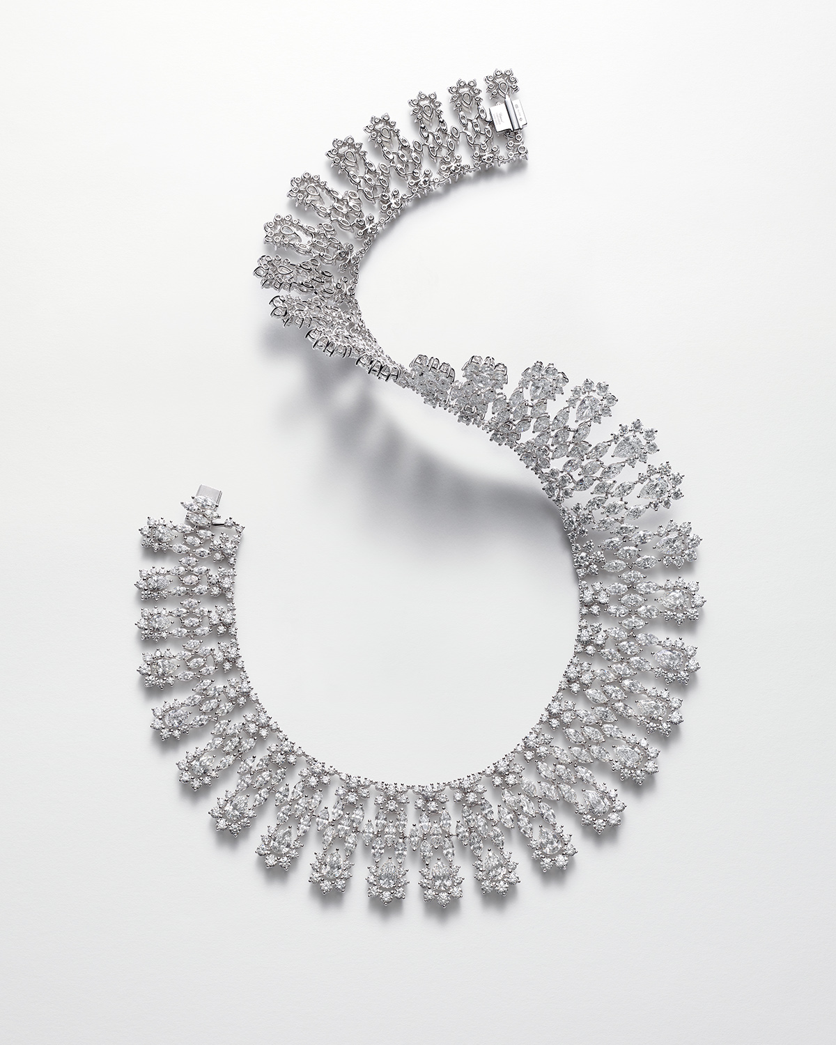 KMA photographer Isabelle Bonjean shoots photograph of diamond necklace against white background for Chopard