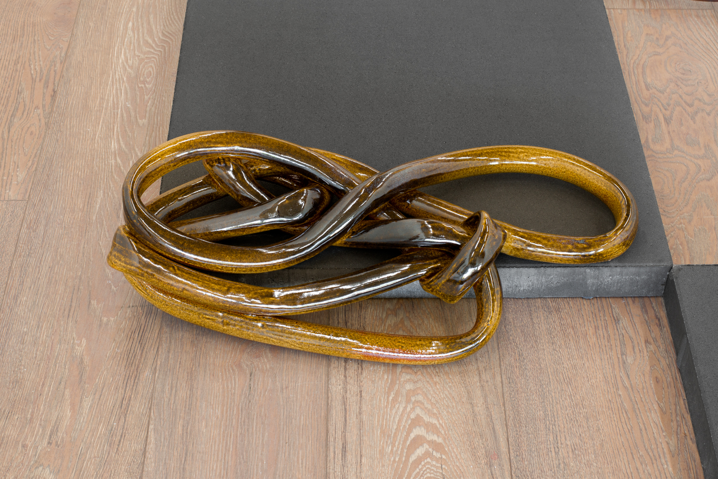 Nicole Ondre, 8₁₁ 2023, 7”x 23.5”x 12”. Glazed ceramic.