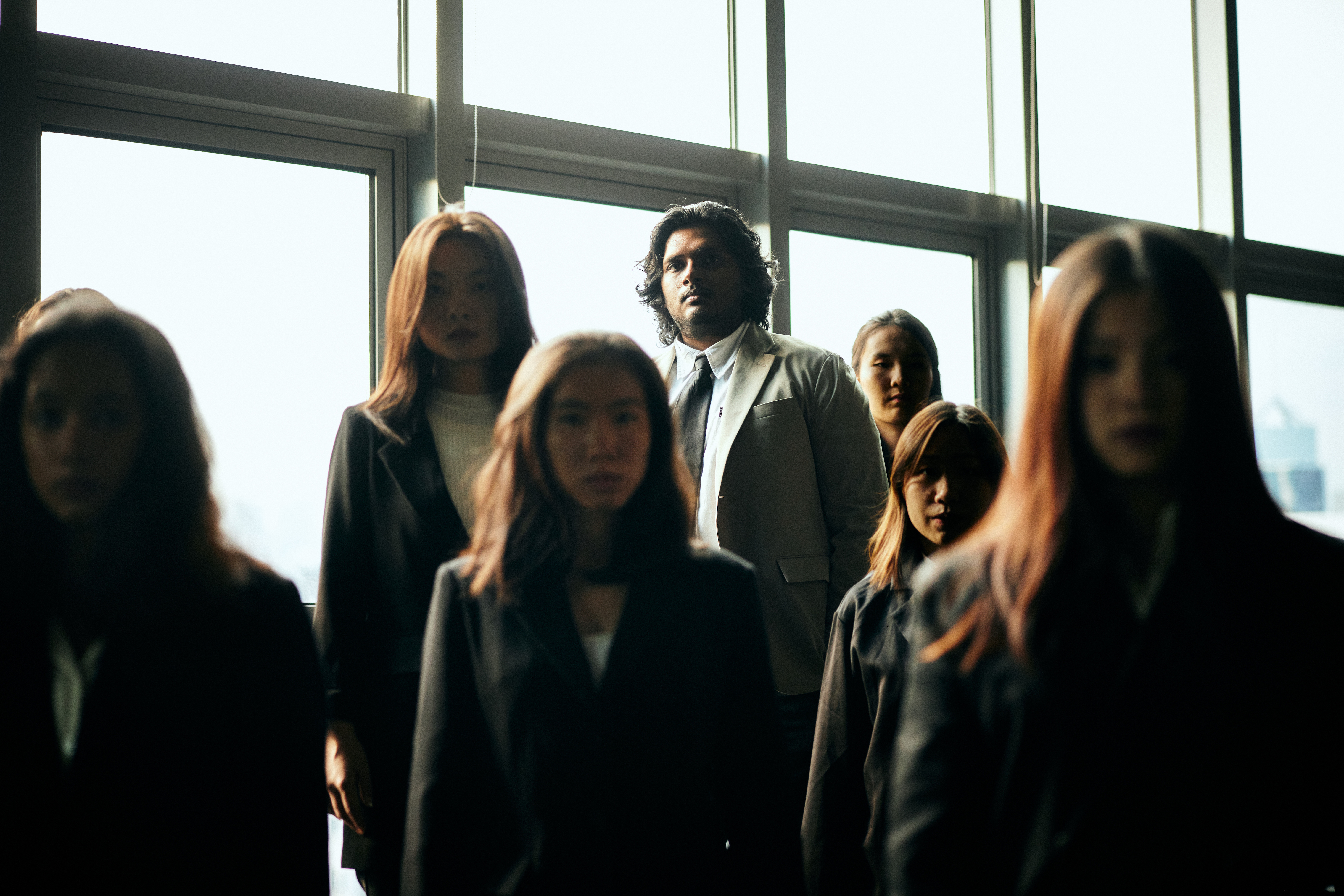 Image 6 of 7: A group of Asian youths