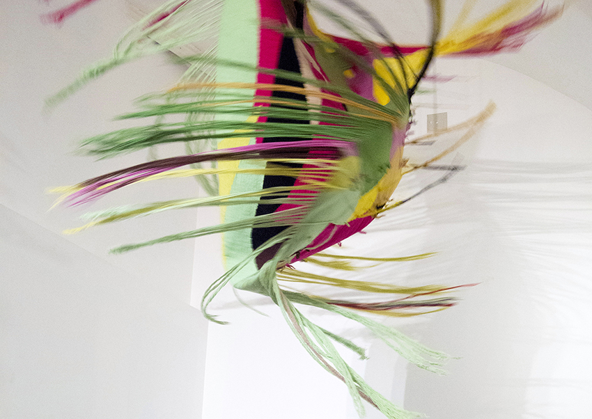 Entre verdes y rosas, 2018, tapestry, metal, motor, electronic controller, 250 x 130 cm