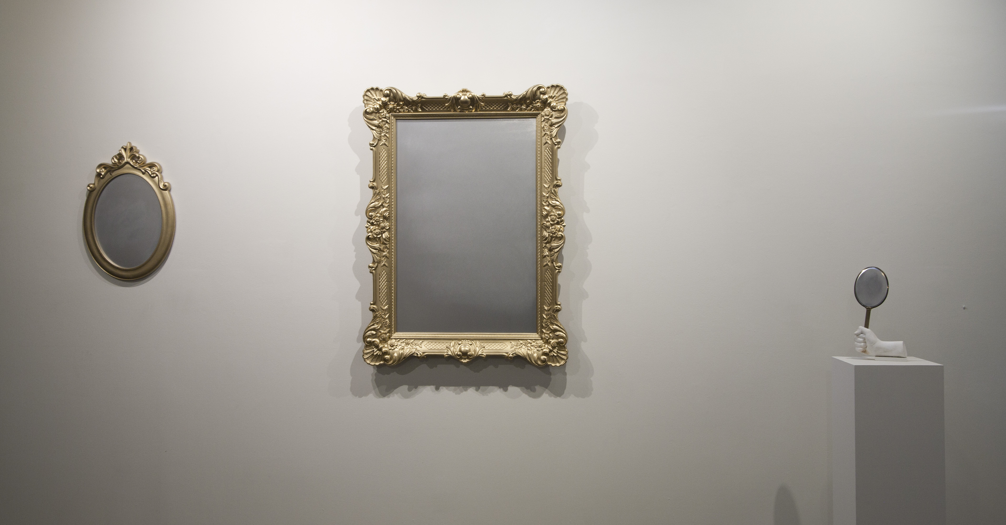 Victorian Colonial Mirrors (two wall, one hand mirror) installation w/found framed mirrors, plaster and paint 2016 variable. Photo credit: Rebecca Marino