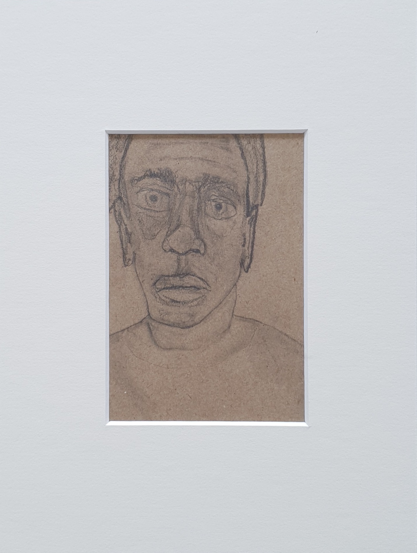 Portrait of a man Fe 1, 12,5/8,5 cm - pencil on brown paper, 2022
