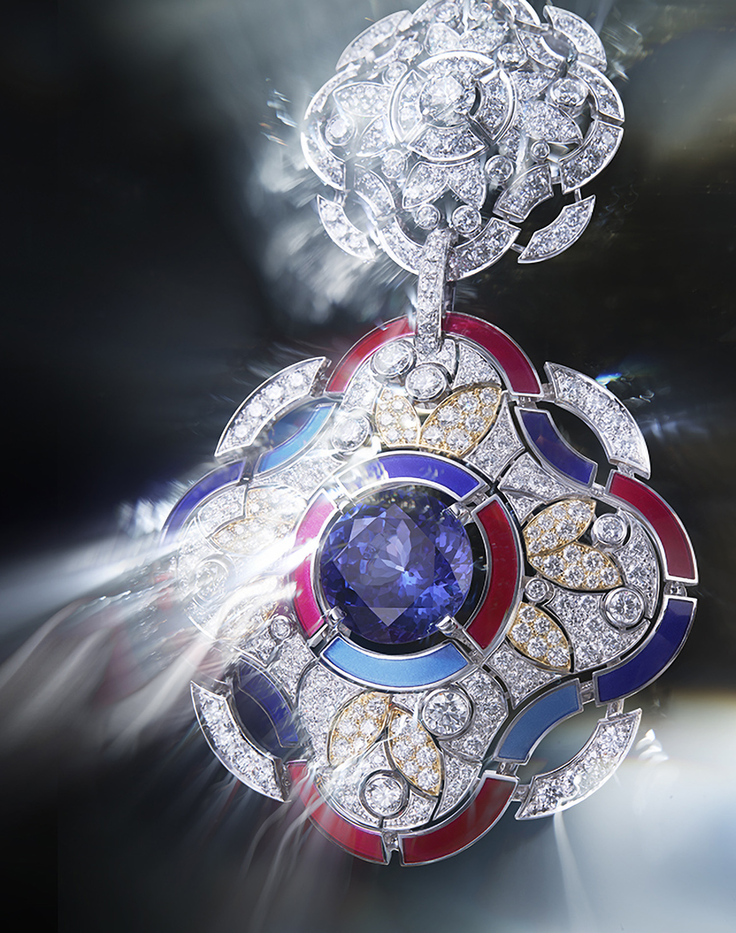 KMA photographer Daniel Schweizer photographs a colorful diamond necklace pendant for Chanel with a shimmery background