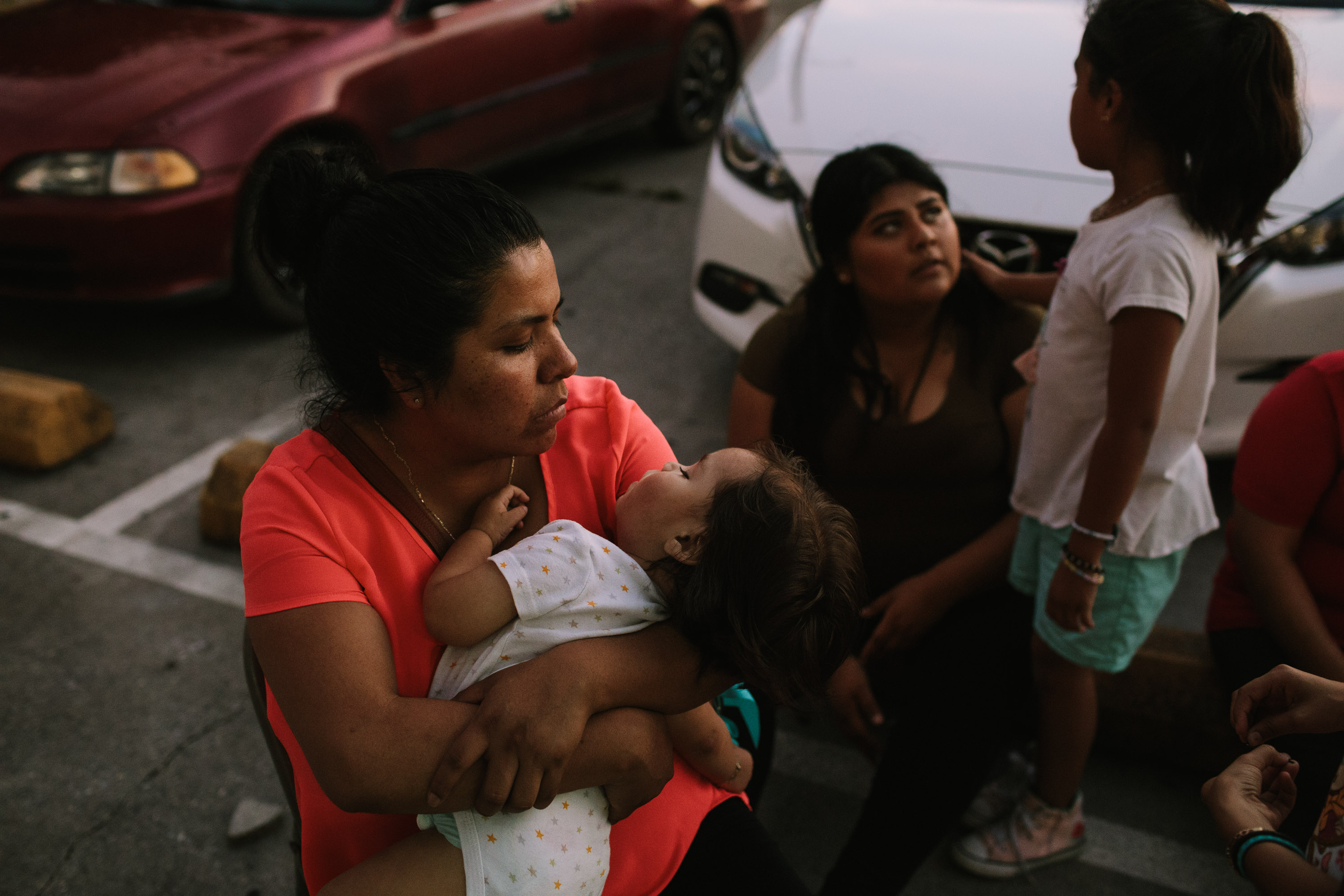 Esmeralda Bautista holds her son, Sahmet, in front of an indoor soccer facility in Morristown, Tenn.