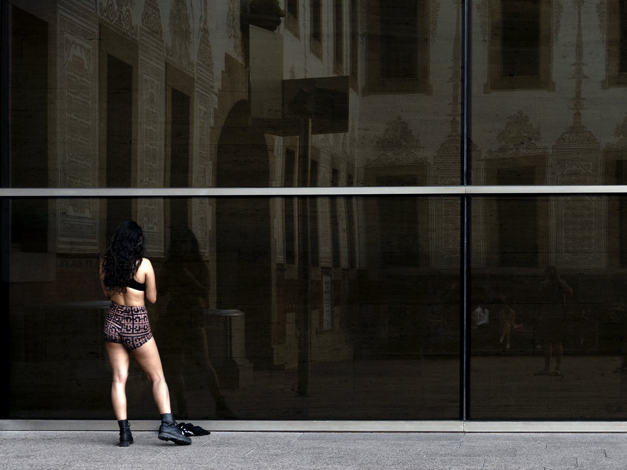 Girl facing a mirror wallBarcelona, Spain, 2023