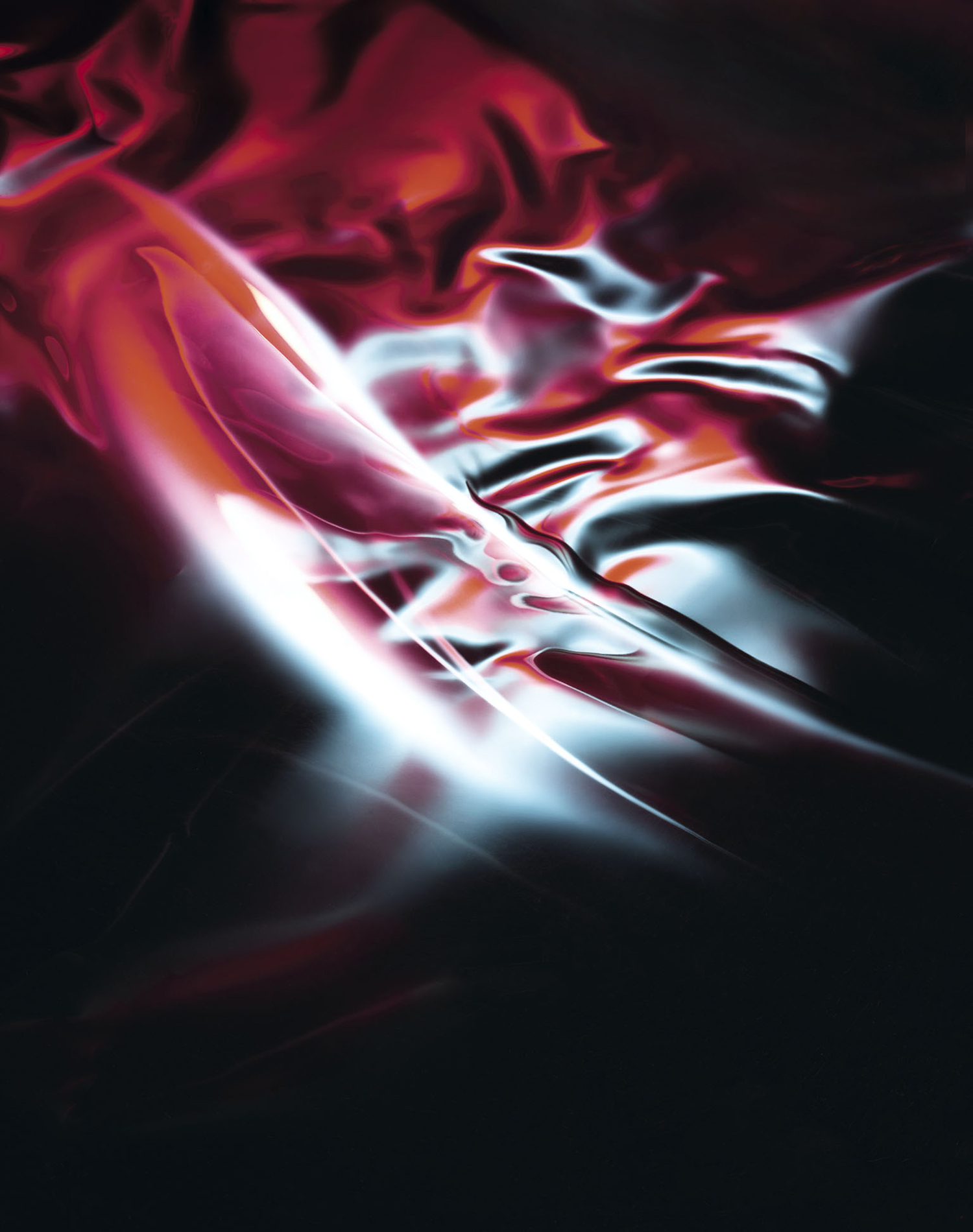 KMA photographer Daniel Schweizer shoots an abstract photo of red and white lights flashing against a black background