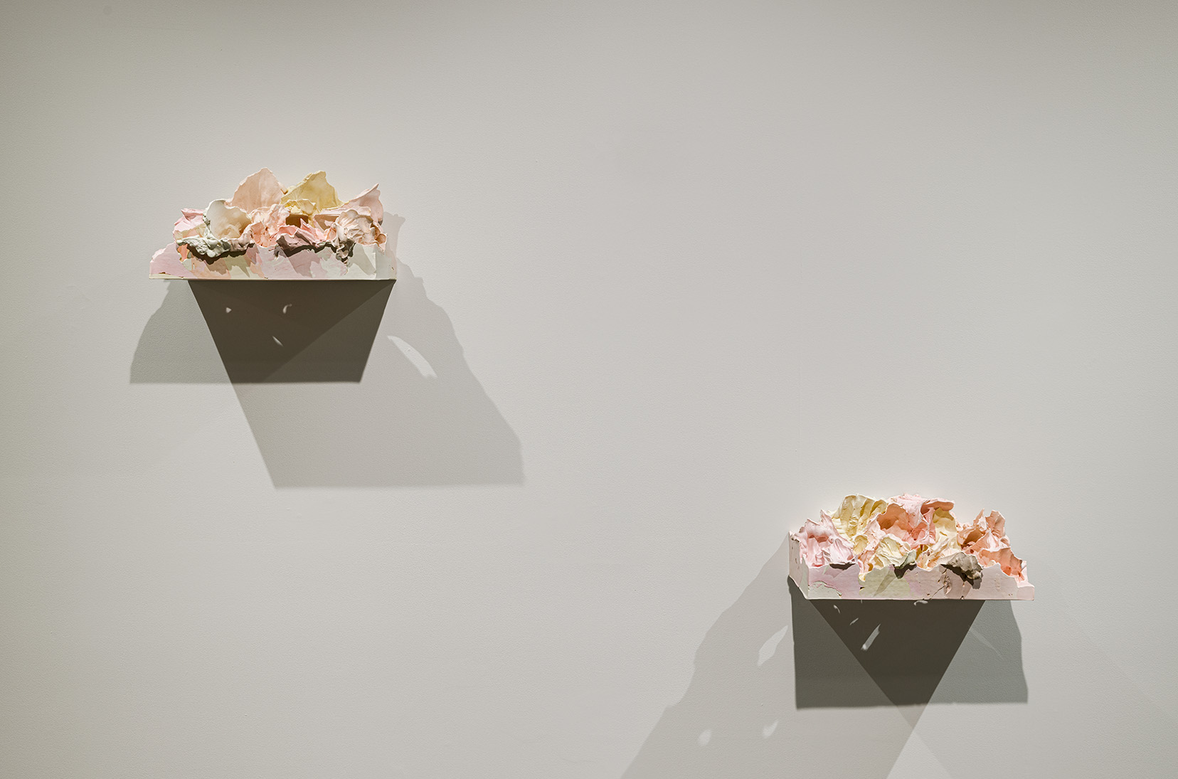 Left: Juliana Cerqueira Leite, "R11," 2017. Hydrocal, plaster, stainless steel and pigment, 14 x 7.5 x 7 inches.  Right: Juliana Cerqueira Leite, "R8," 2017. Hydrocal, plaster, stainless steel and pigment, 14 x 7.5 x 7 inches. Photo by Etienne Frossard.