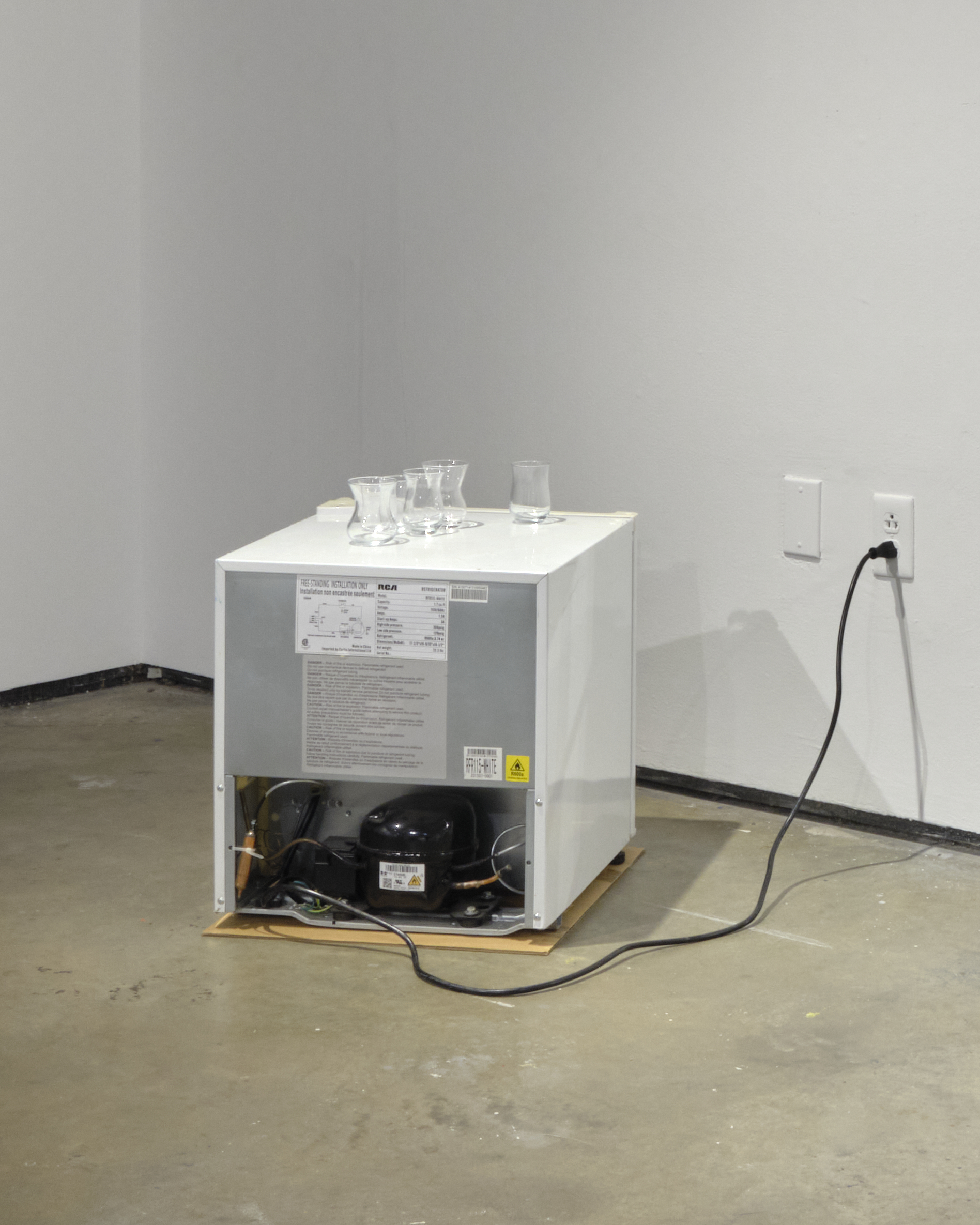 Glasses on fridge, 2022. Sound from shivering glasses on fridge, 18 x 20 x 19 in.