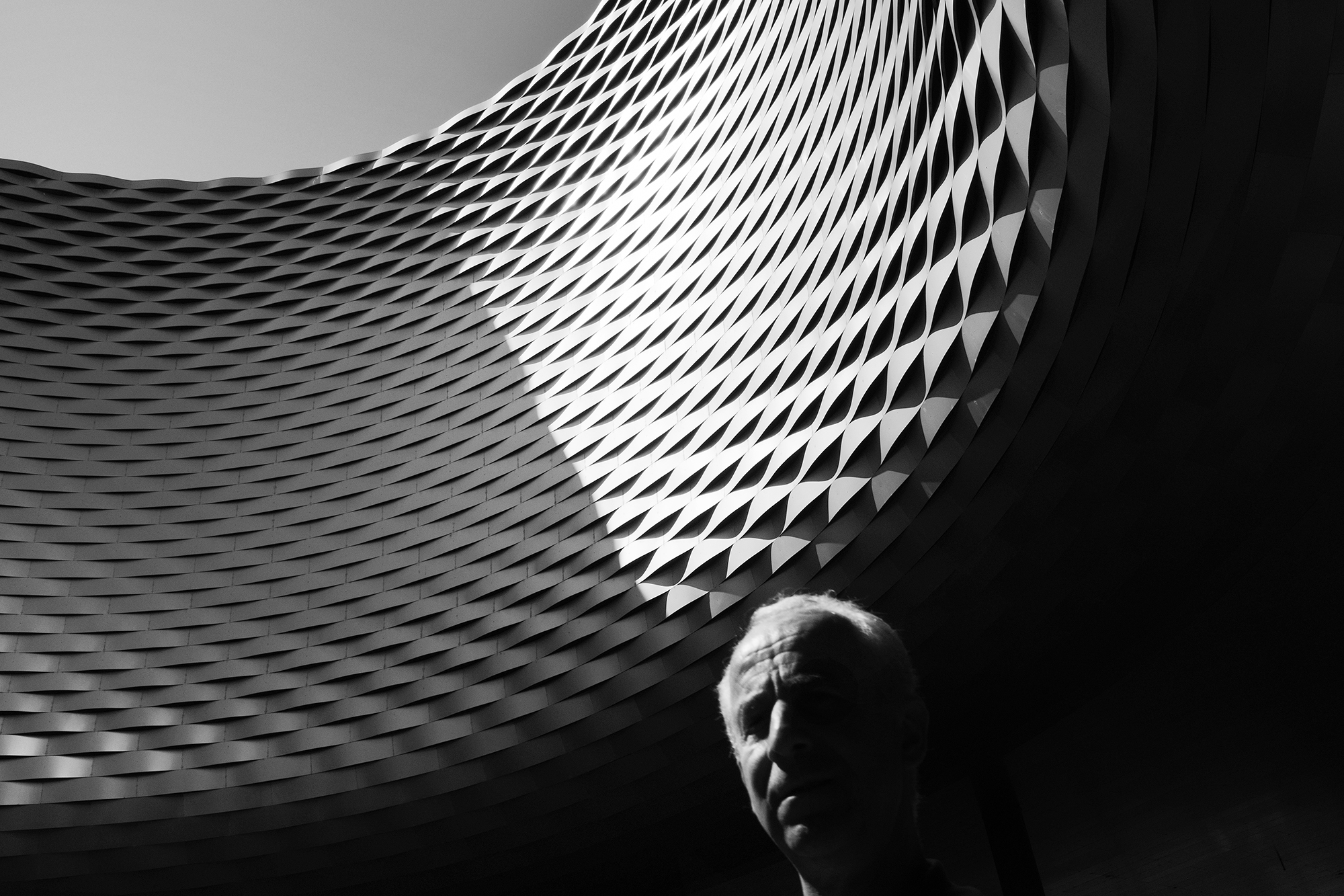 Philippe Sarfati-Territories-photography-photographer-street-documentary-architecture-black-and-white-messe-basel-herzog-de-meuron-switzerland-old-man-thoughts-hole-geometry-scales-curved-metal-louvres