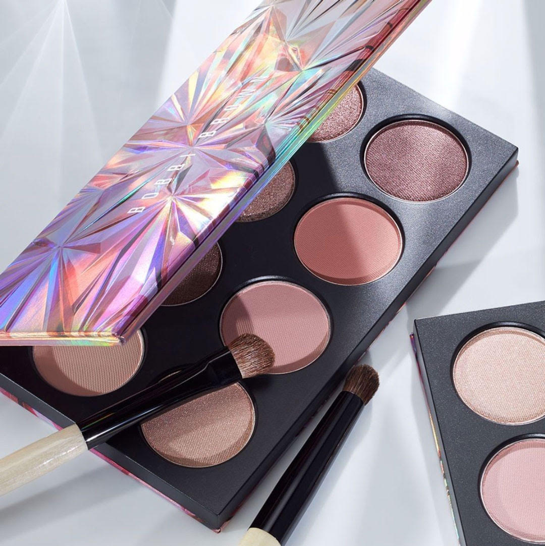 KMA stylist Rachel Haas designs set for photo of colorful eyeshadow palettes against white background for Bobbi Brown