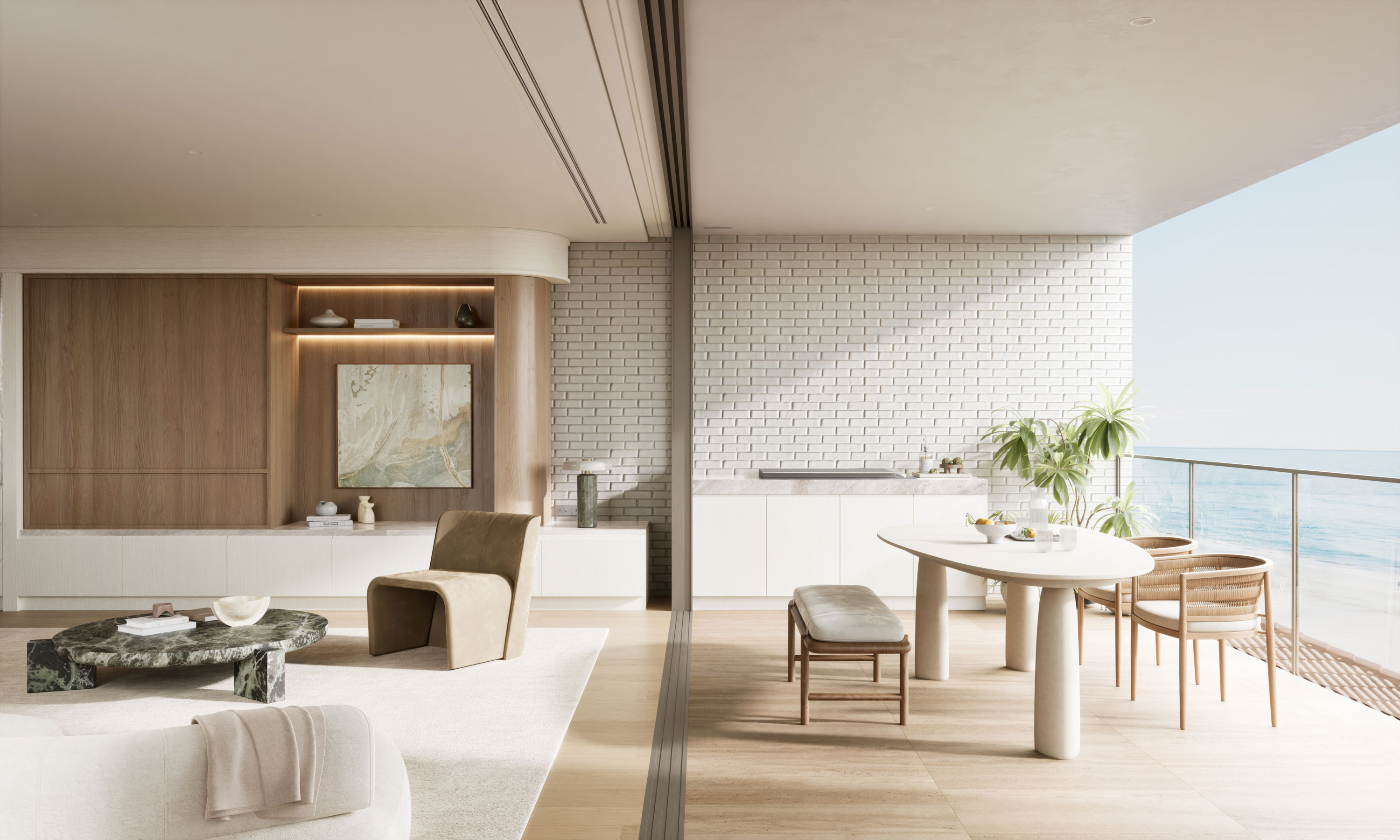 Seamless indoor-outdoor luxury living: a minimalist living room with warm oak wall unit, abstract art, and plush suede seating flows through full-height glass onto a sunlit oceanfront terrace with a marble dining table, woven chairs, and panoramic sea views.