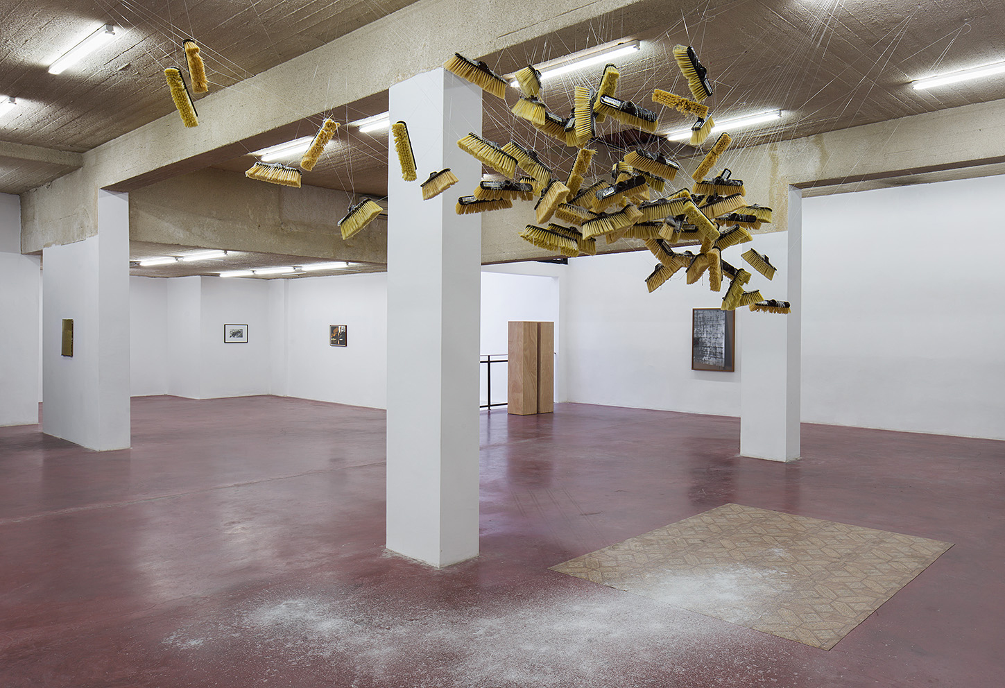 Dirty Mind, 2017. Brooms, wax, nylon strings, PVC. Dimensions variable (installation view, Dvir gallery, Tel Aviv).