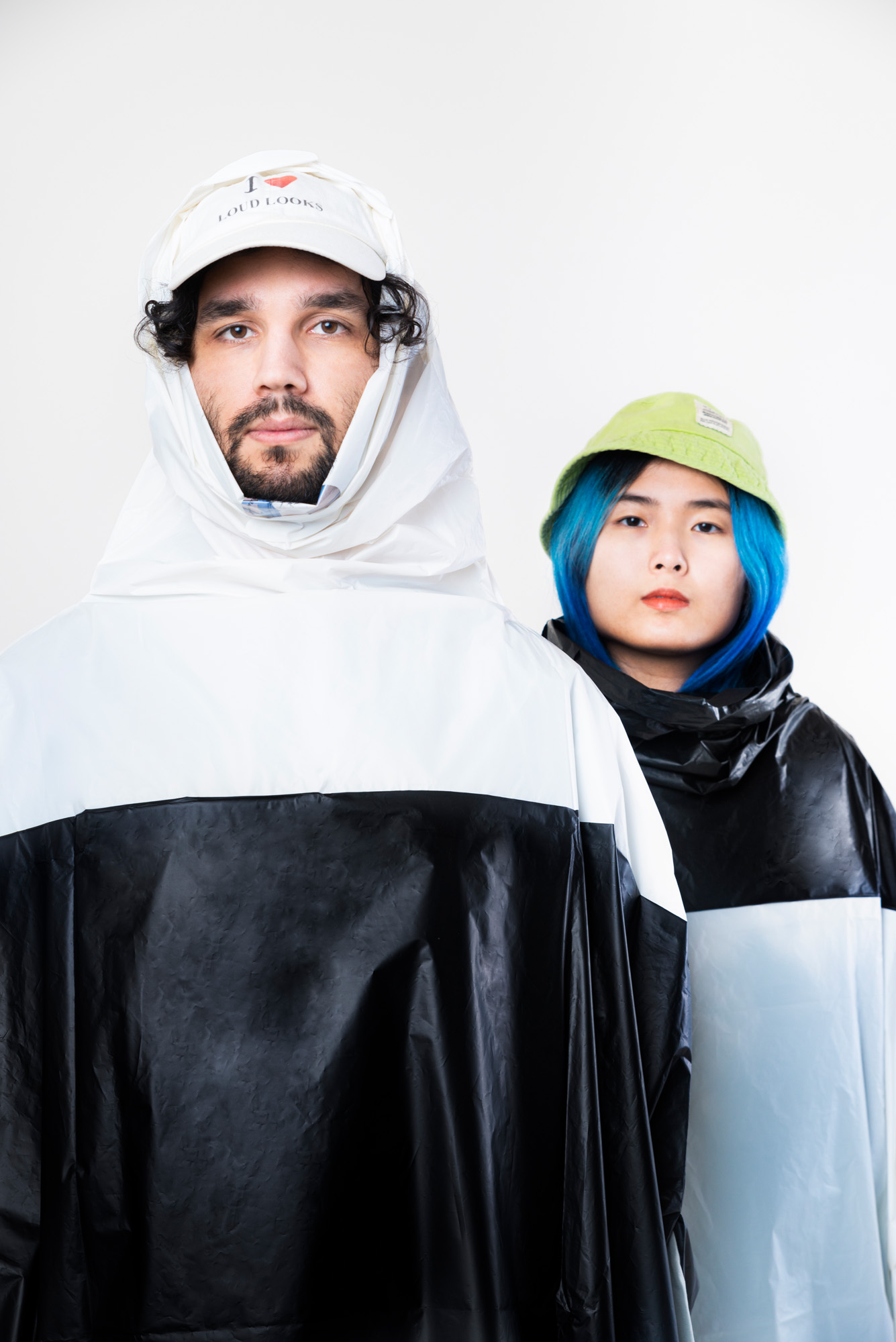 Weather Underground Biodegradable Raincape by Verena Michels COLOUR: 2-tone black top and 2-tone white top