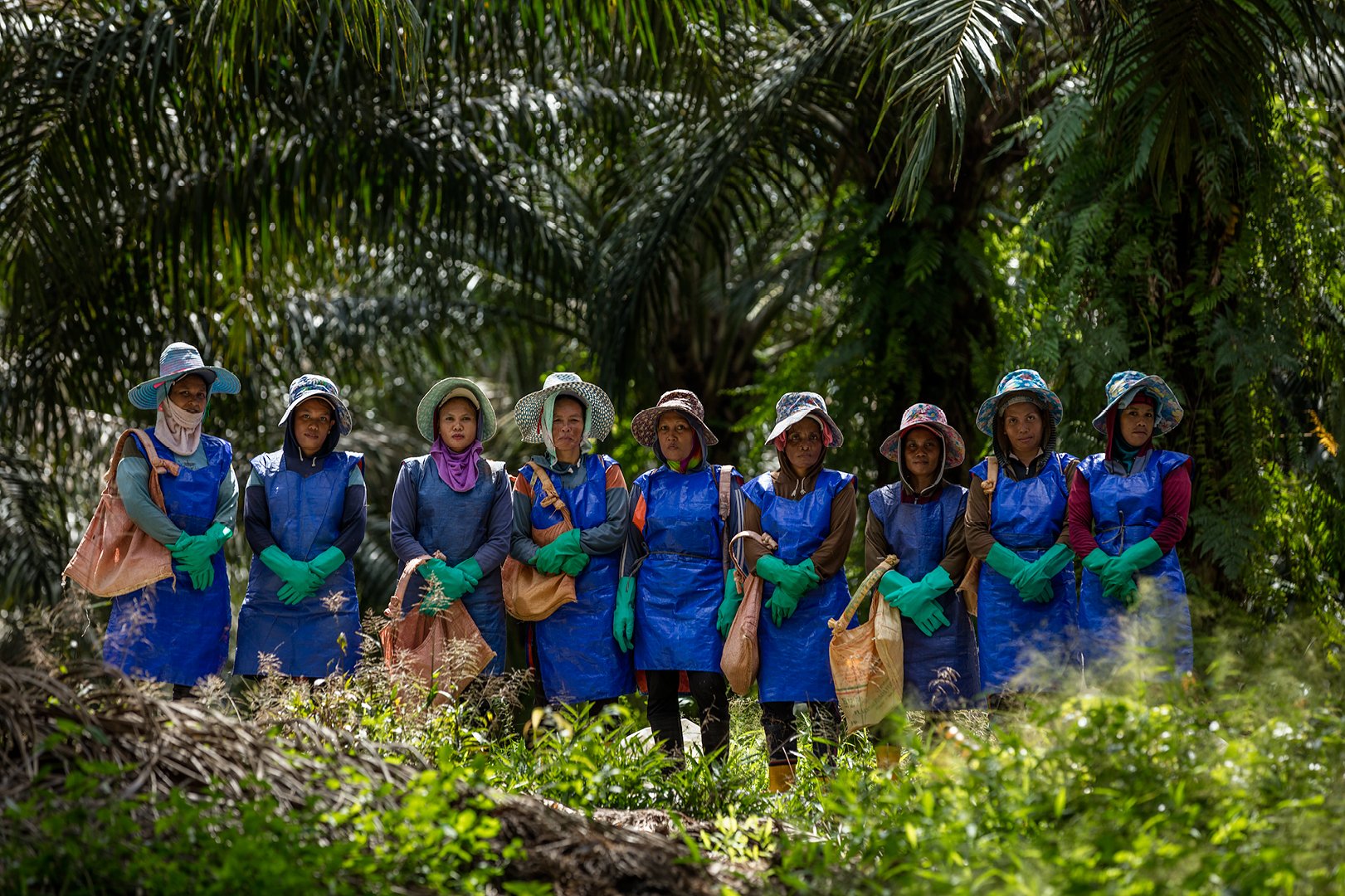 Female farm workers hold bags of Canadian potash fertilizer.