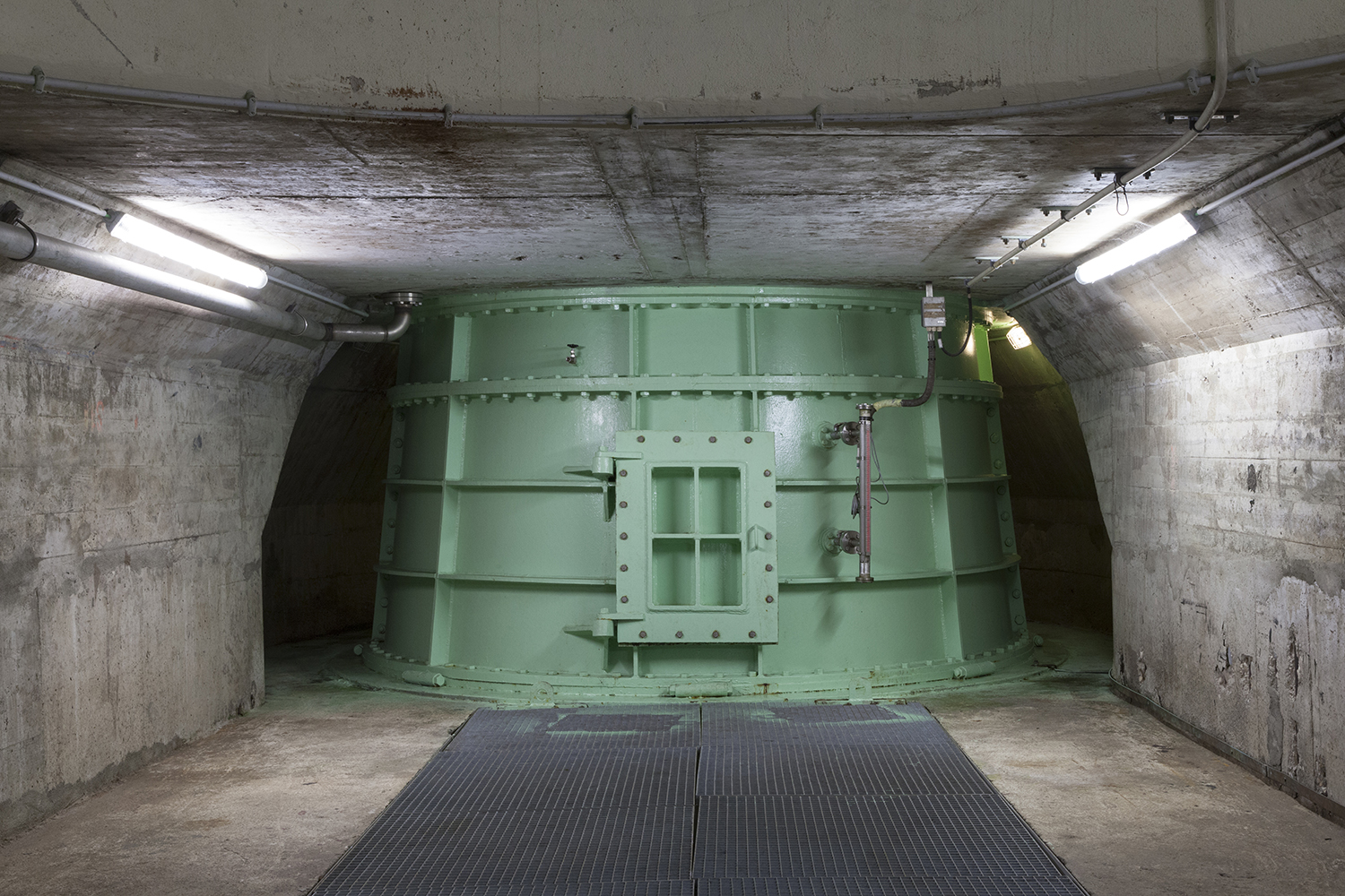 carina martins, vortex - green turbine in a tunnel dam