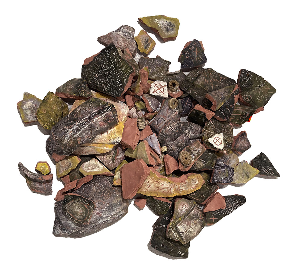 broken pot Iunderglaze on ceramic and crinoid fossilsdimensions variable2021