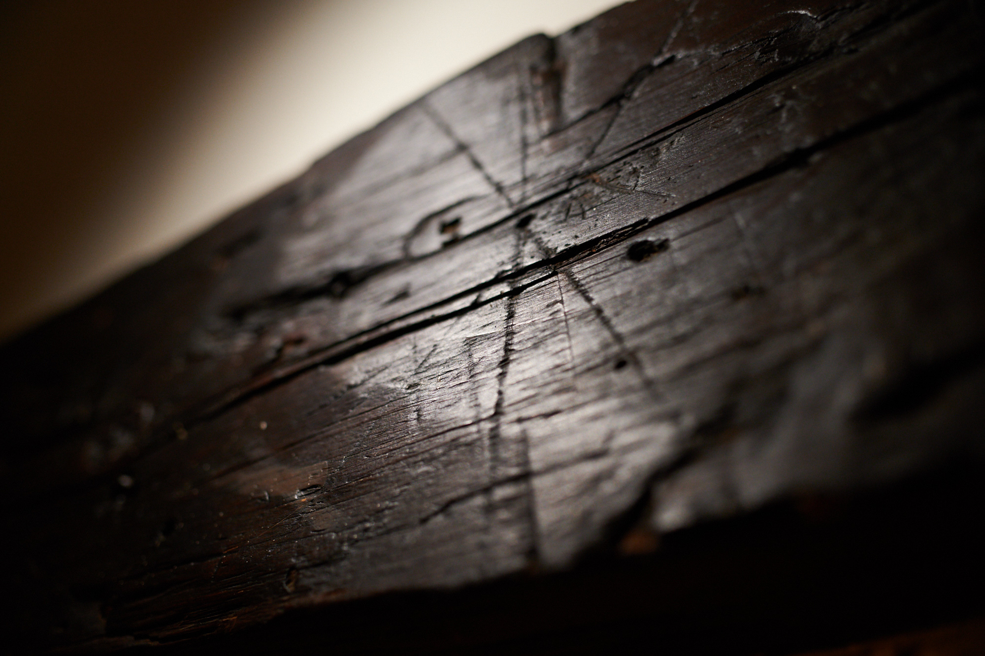 An apotropaic mark carved into the stairway of the Corwin house, now known as The Witch House. Marks like this were understood as an acceptable form of magic intended to protect the home from witches. Judge Jonathan Corwin was involved with the Salem witch trials. Salem, MA.