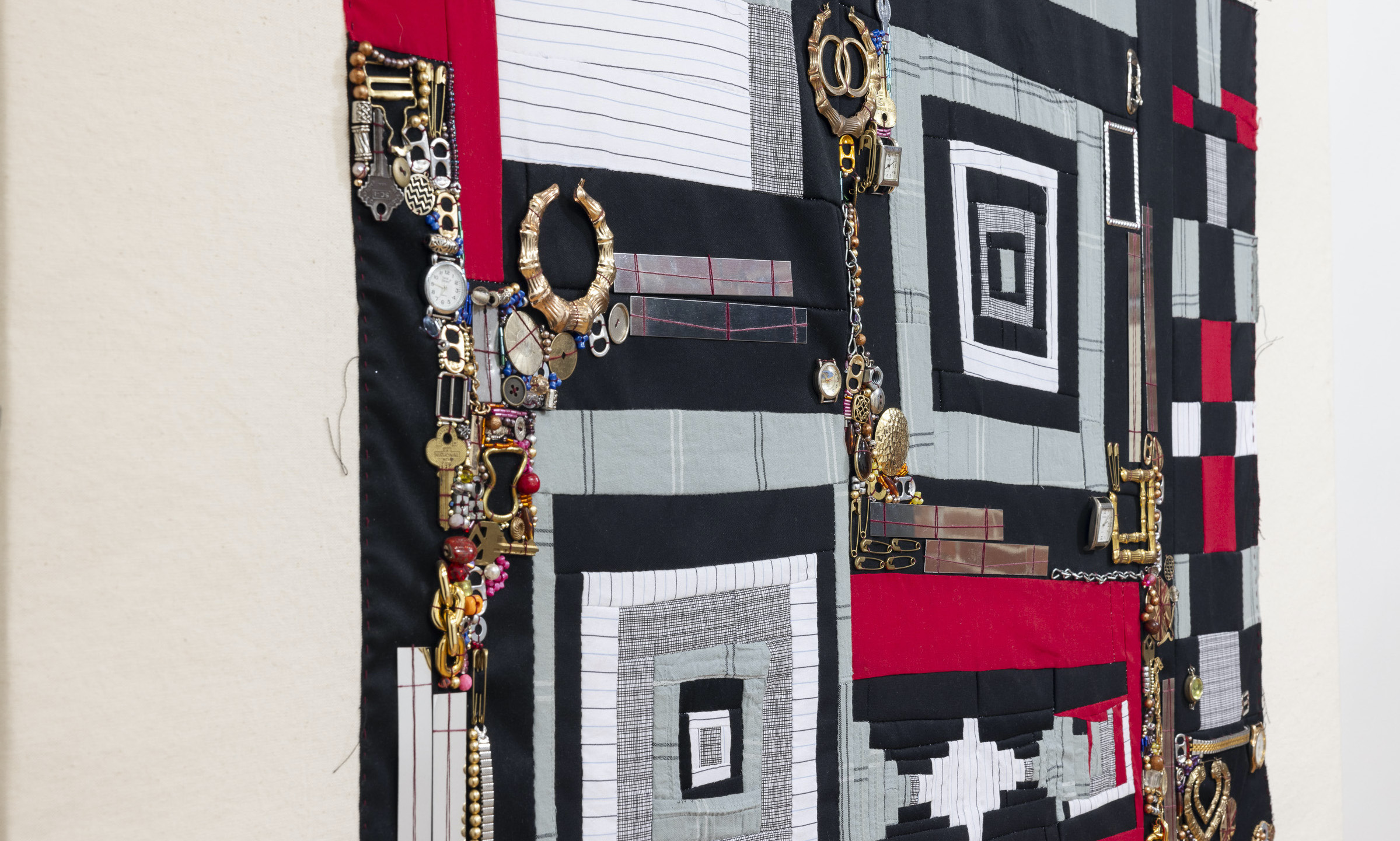 She | Cotton fabric, bamboo earrings, and found objects mounted on canvas stretcher | 60 x 35 &frac12; x 1 &frac12; in | 2023