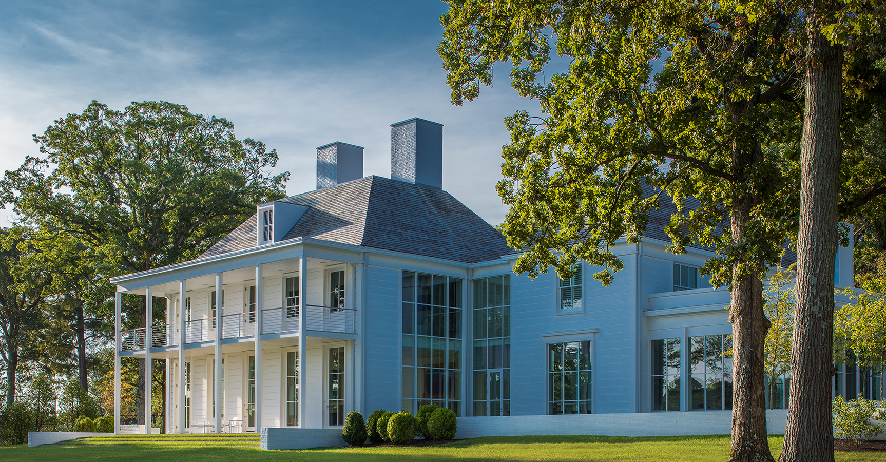 The waterfront façade contains a two-story sitting porch