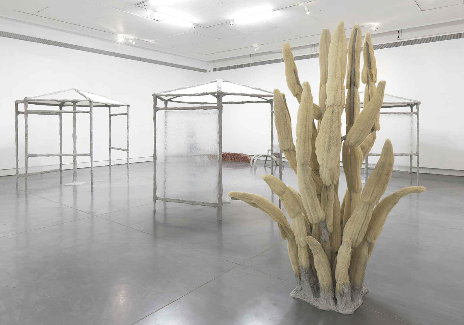 Springs, 2017, concrete, steel, burlap, glass, vaseline, egyptian loofah, hand towels, plaster, pigment, folding chairs, umbrellas 