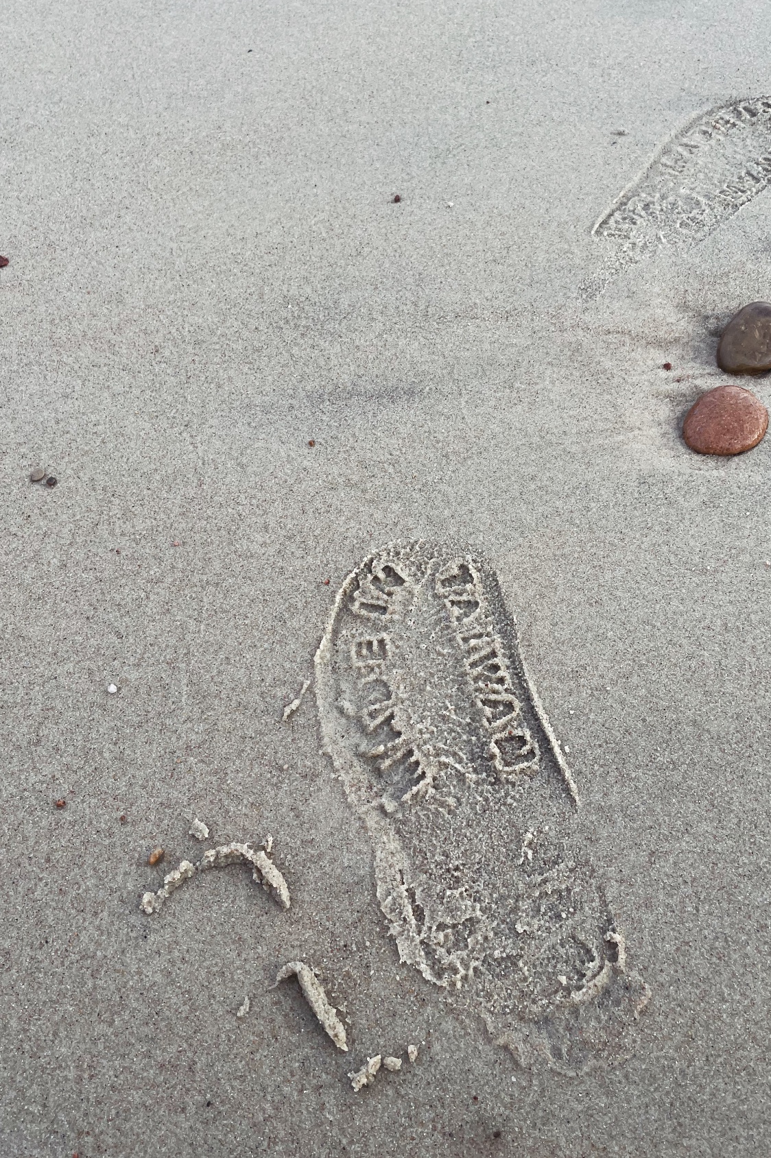 Sandals on sand. Nida Beach, Lithuania. October, 2025