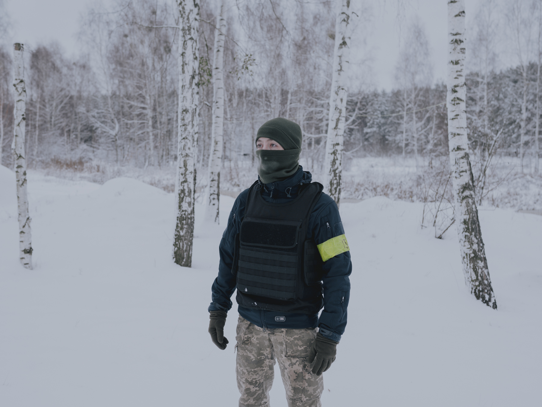 Artur, 25, poses for a portrait at a military training ground in northern Kyiv Oblast. He fled to Kyiv in 2016 from the island of Crimea, where he faced the threat of being drafted by the Russian military. Kyiv Oblast, 19.11.2022.