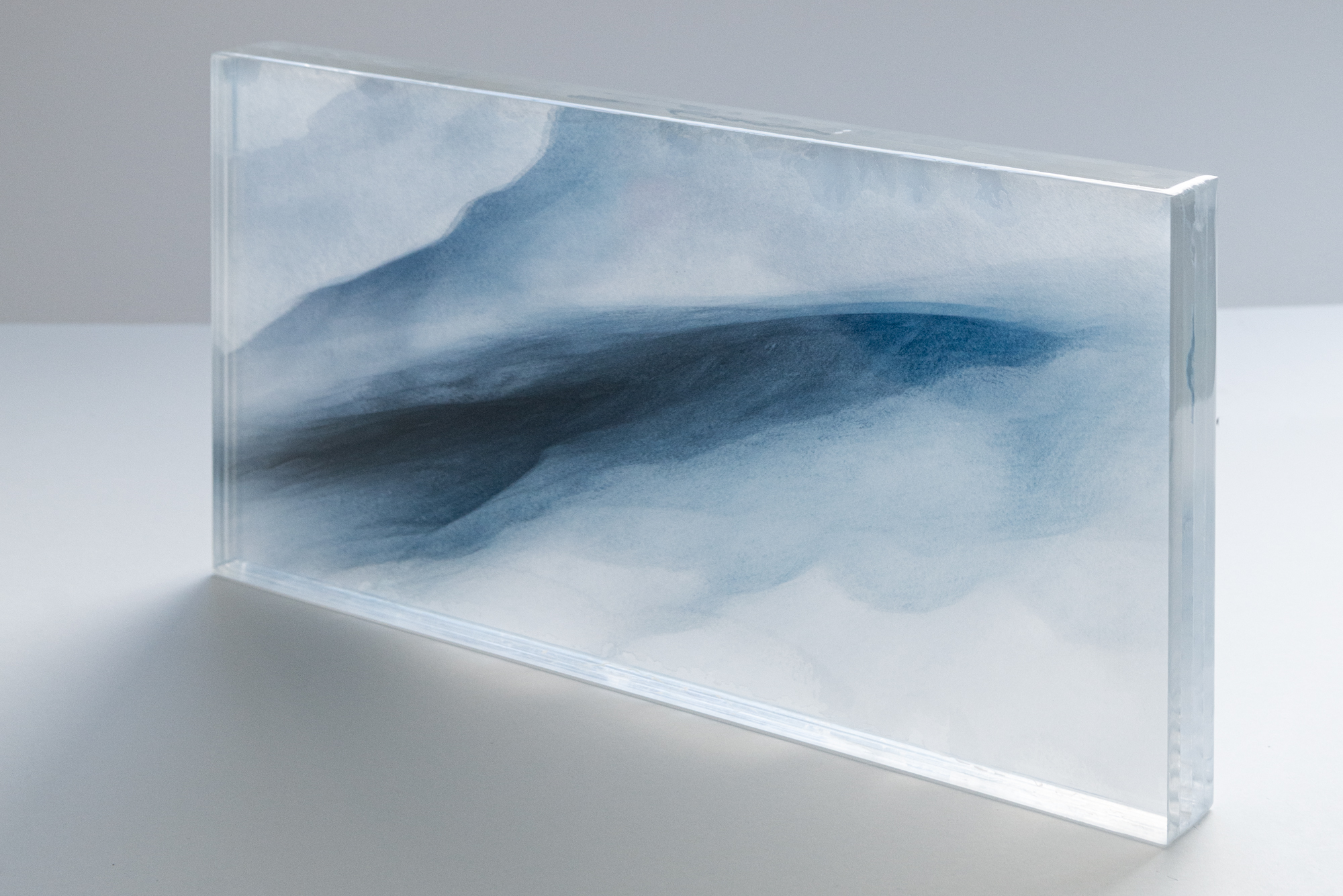 GLACIER #2 | 2024 | UNIQUE PIECE | Layered sculpture, consisting of printed transparents & 10gs washi paper, cast with resin | 56 X 28 X 5 CM