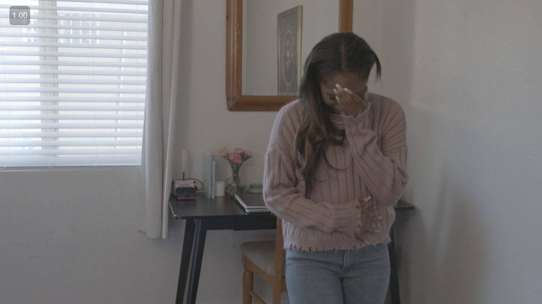 At her wit's end, Leila unravels herself, literally frayed at the edges and seams like her sweater.