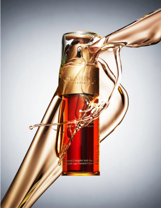 An intensified splash creates a sleek look for Clarins Double Serum shot by Still Life Photographer Daniel Lindh