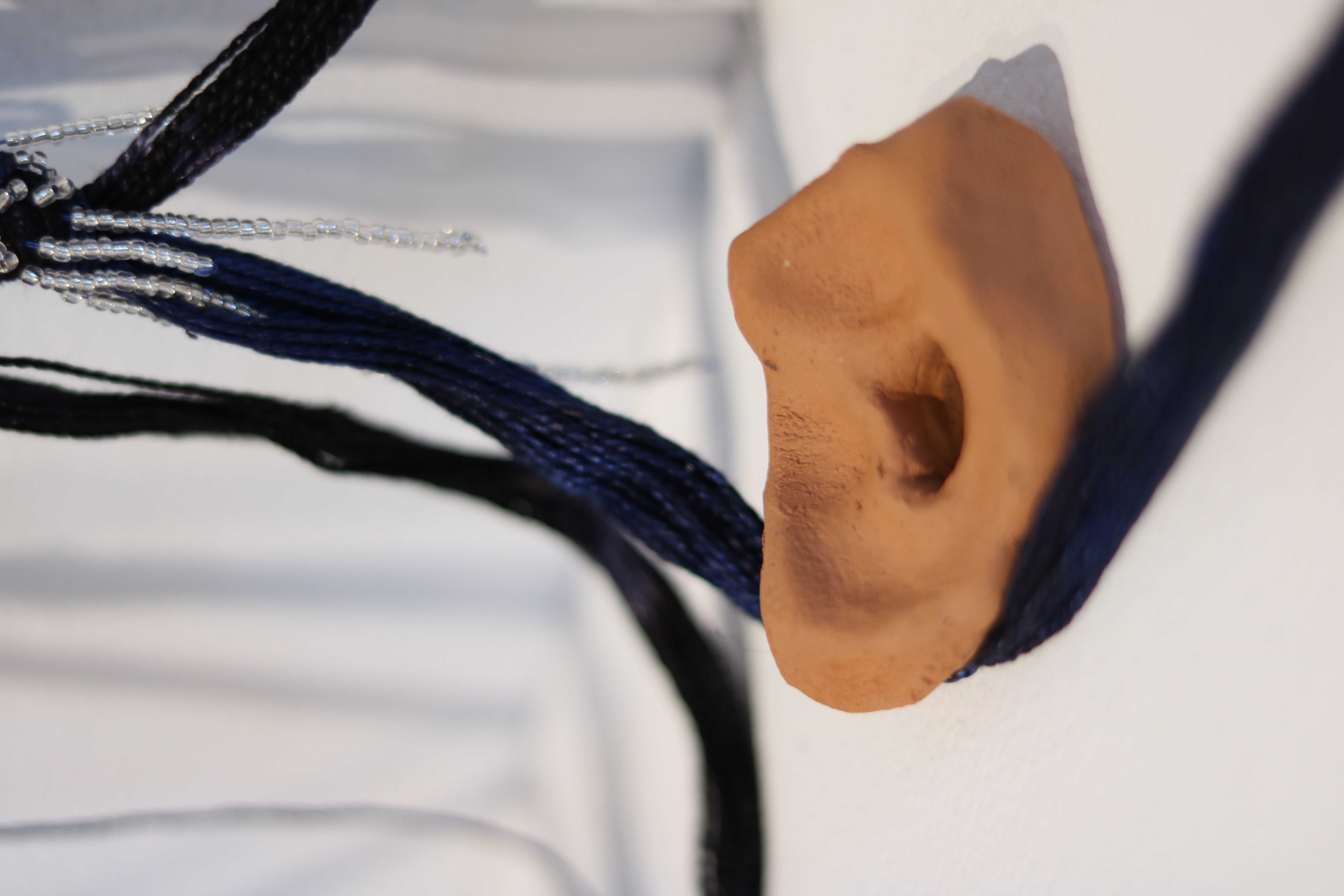 something that goes on for too long (twins), (detail), silk, wool, glass beads, wild clay