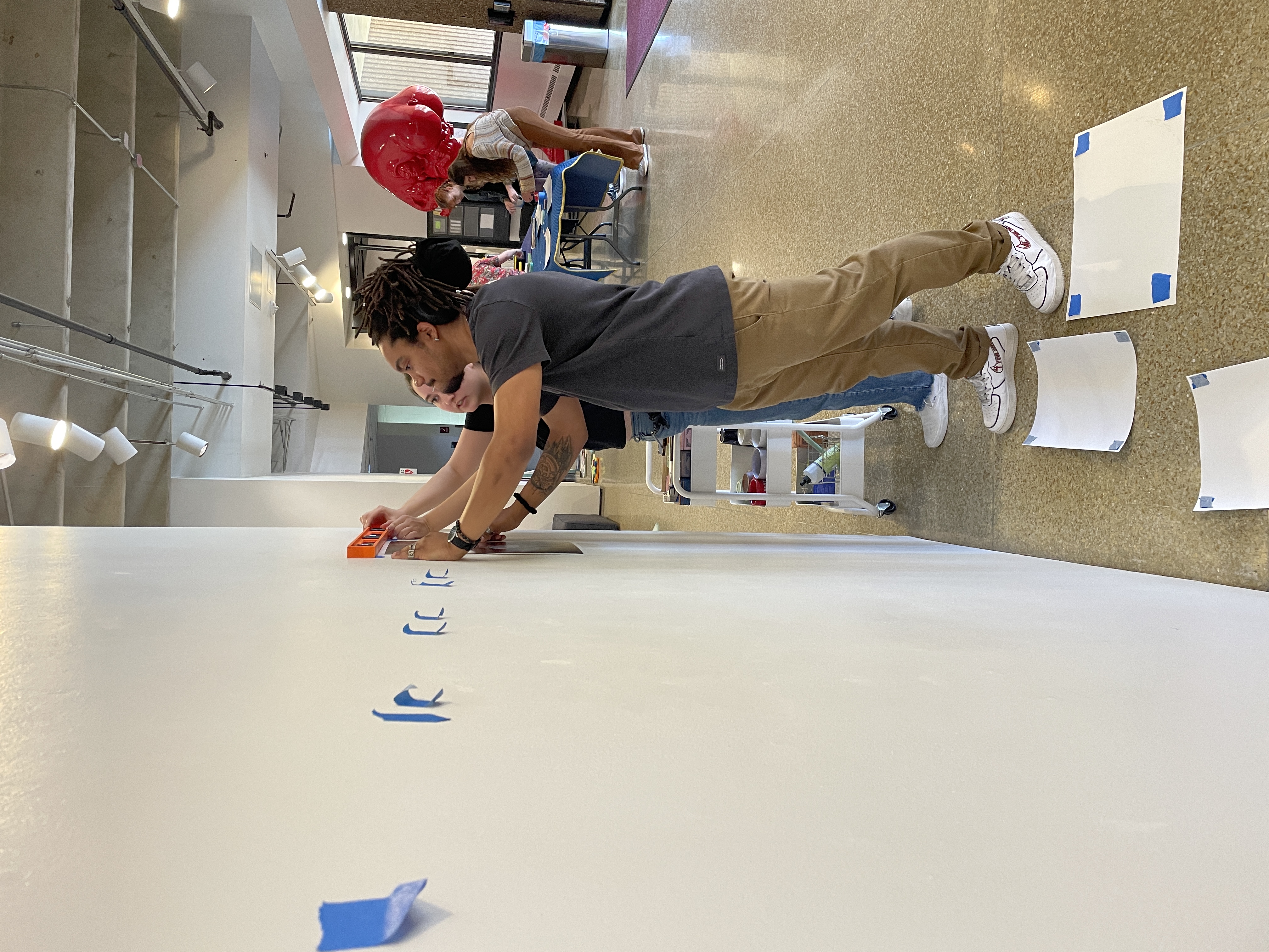 Students installing their final exhibition
