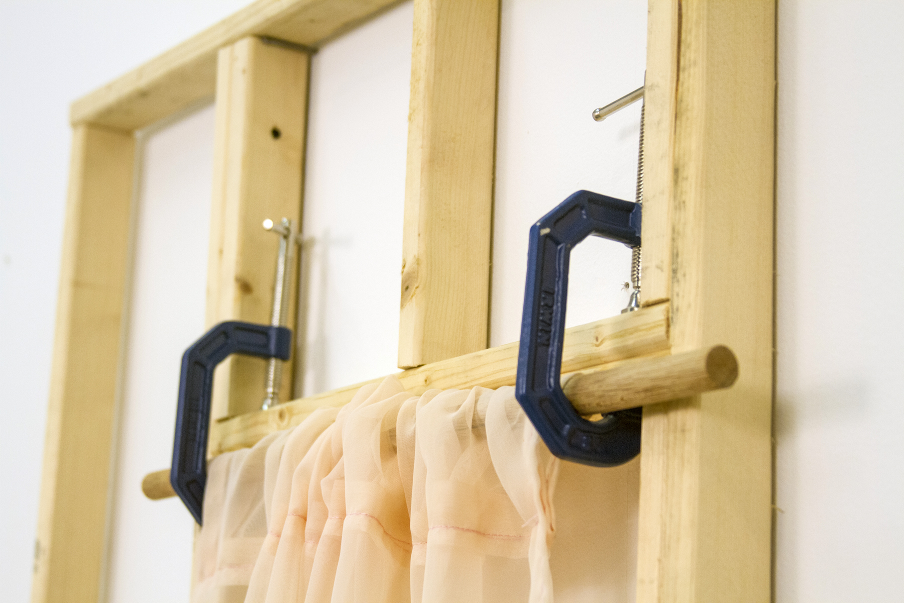 Detail of Through Which I Modulate the Sublime, 2018, dimensions variable. Wood, screws, c-clamps, polyester fabric, epoxy resin