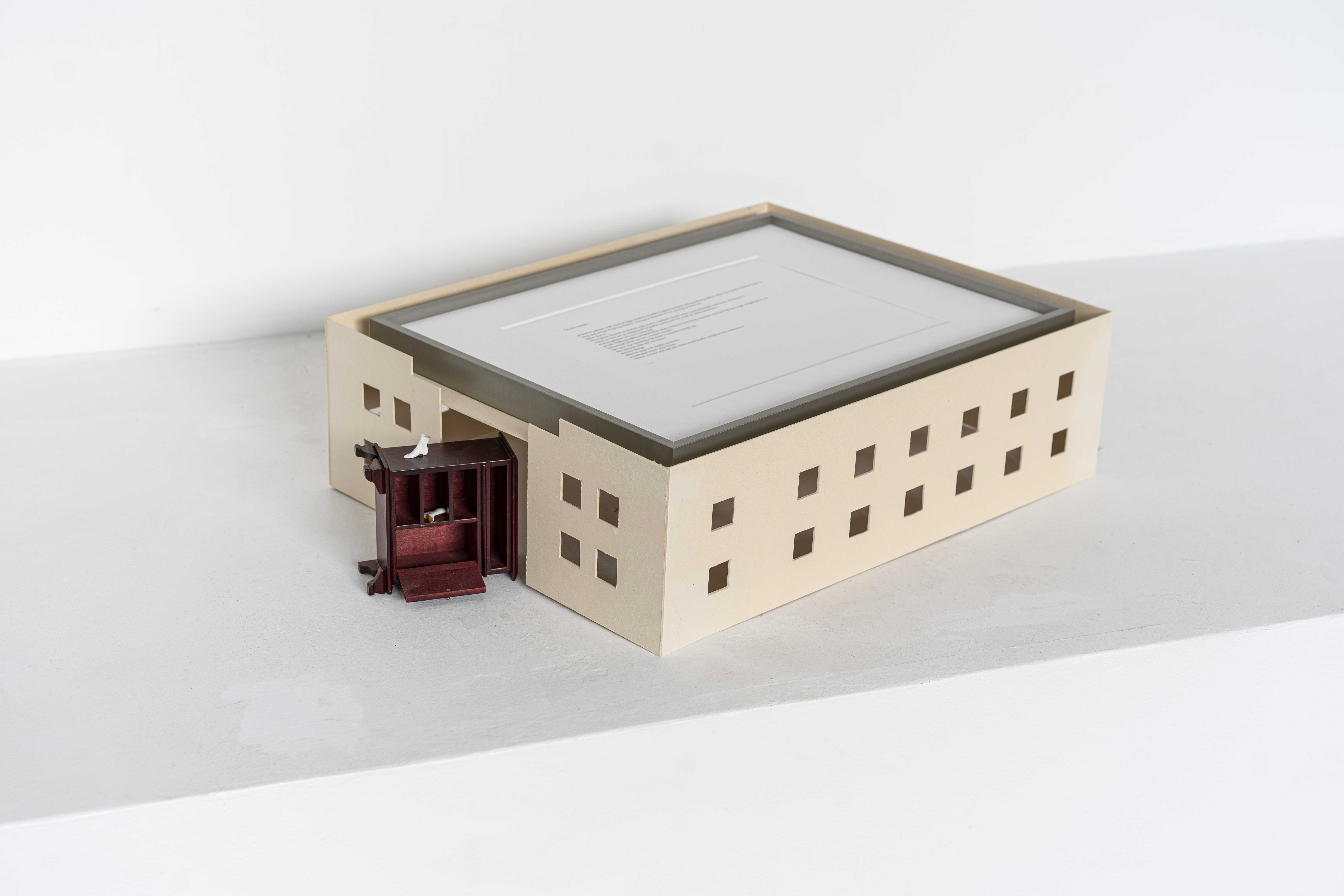 Sally West – A walk around the neighborhood, 2023, Cardboard, dollhouse furniture, oxidized pennies, print on paper, aluminium frame, birthday candles, blue ribbon