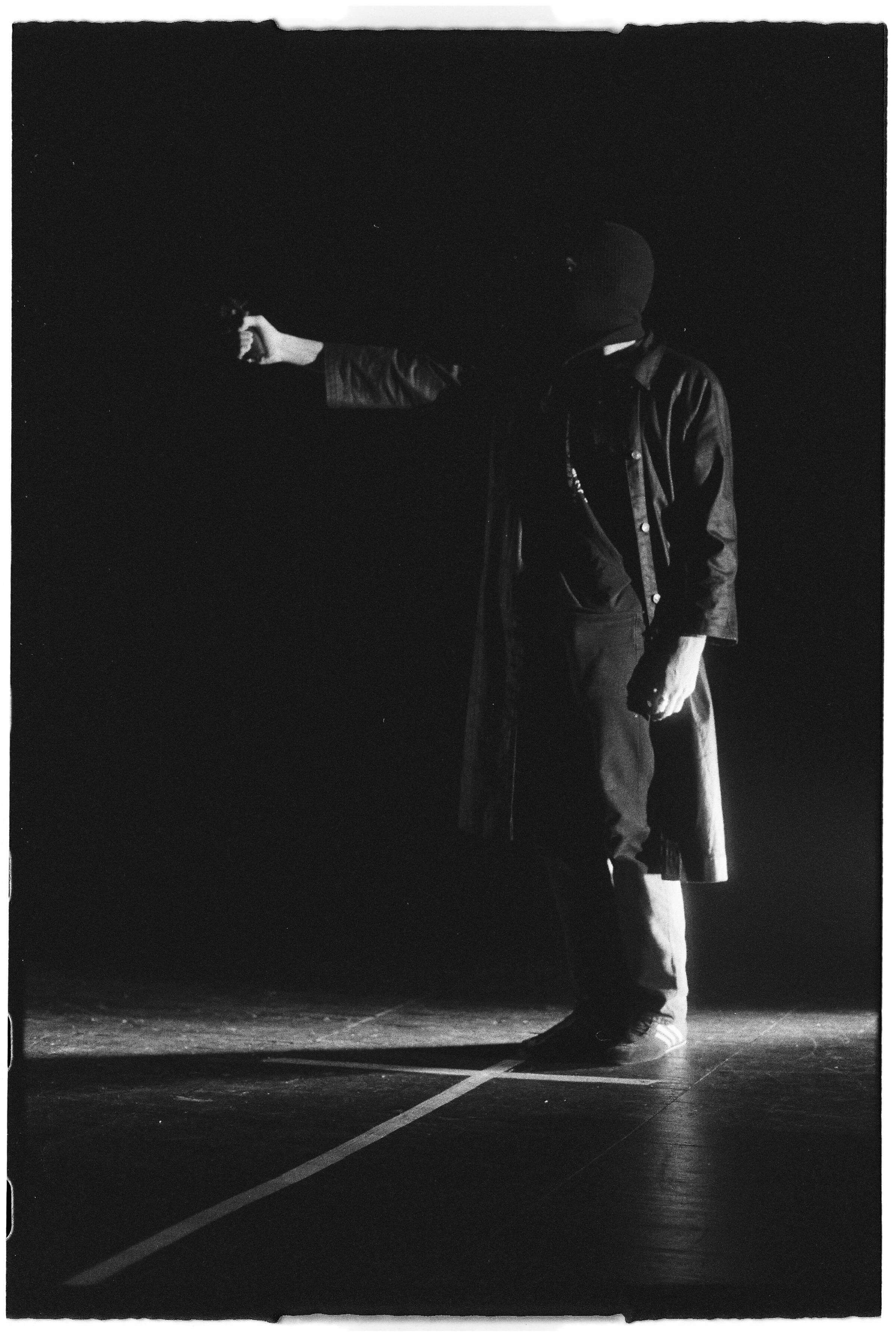 Daniel Rived Pointing a Gun Wearing Balaclava