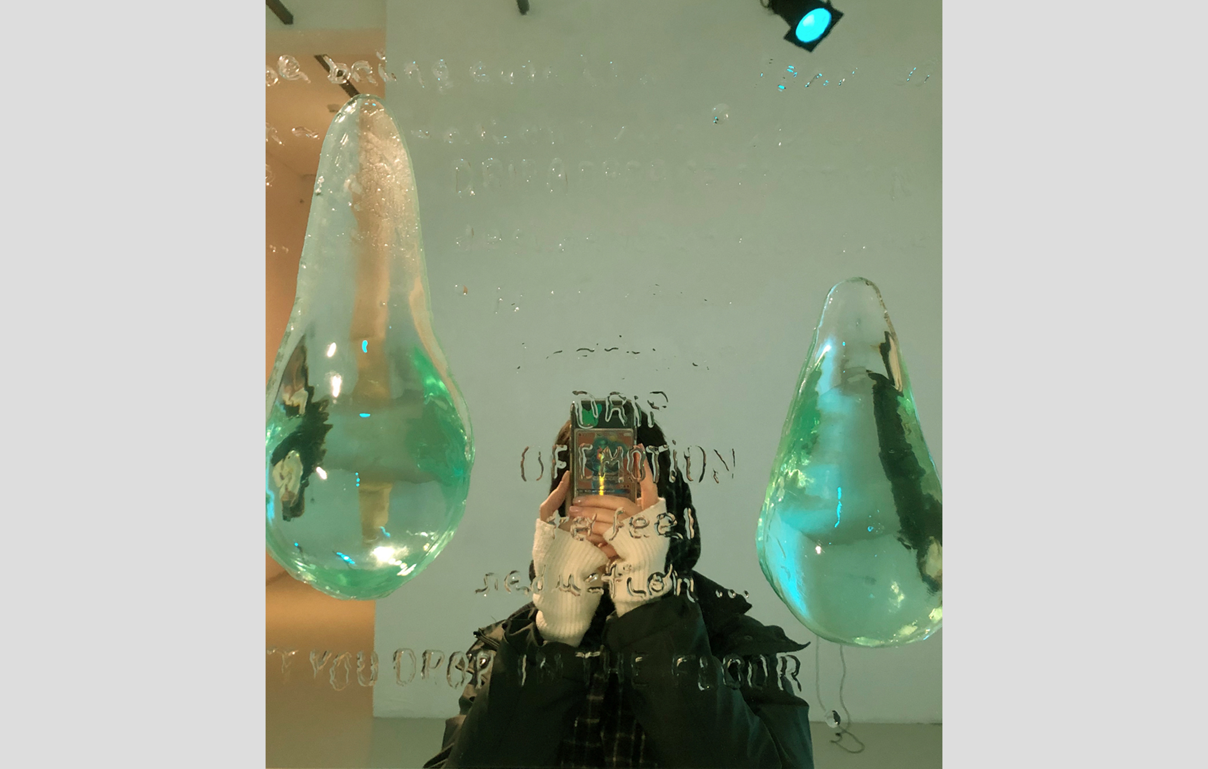 Detail of text written on the mirror with liquid resin