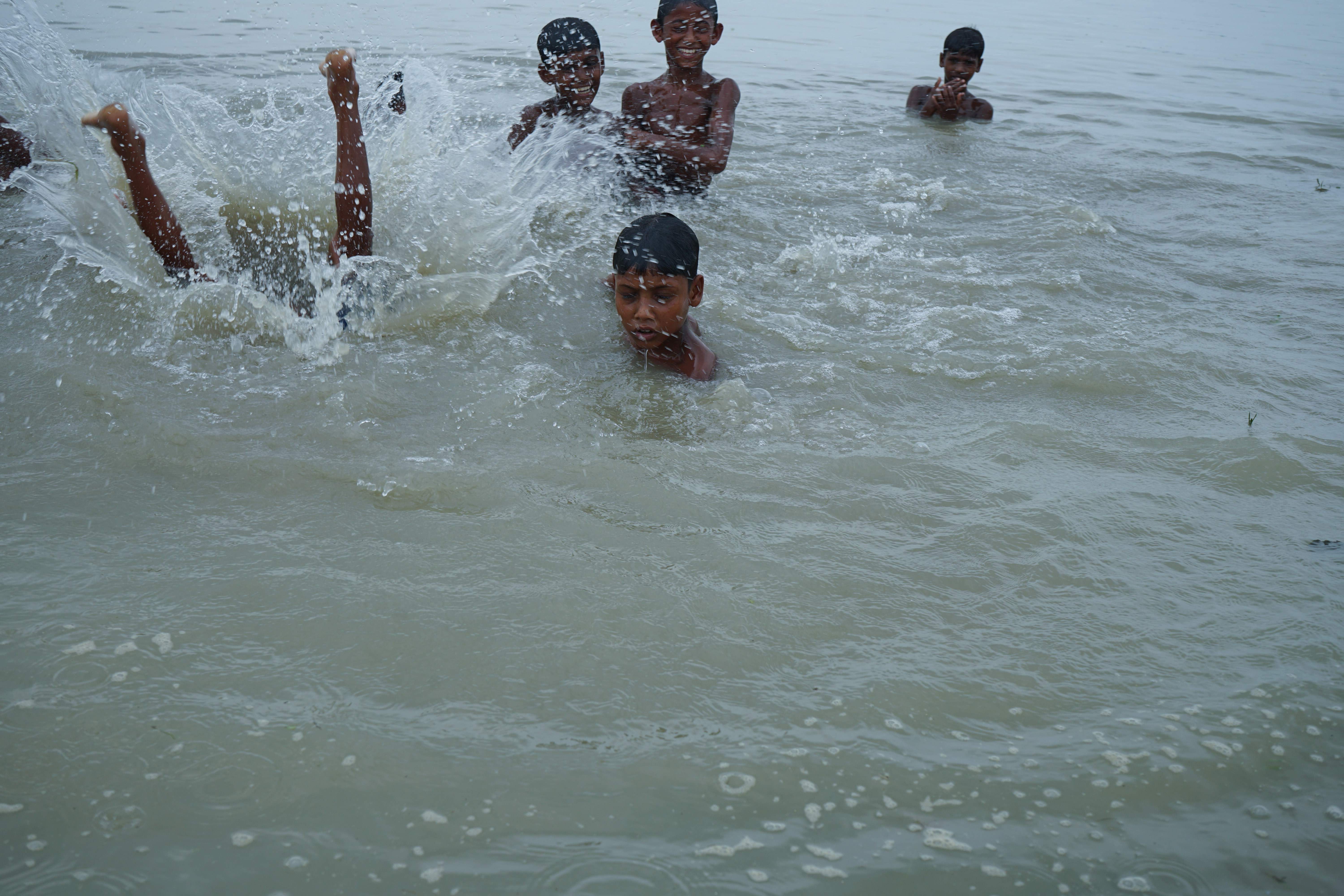 Kids play in the water near their homes on a char near Gaibandha, Bangladesh. Chars, shifting riverine islands, have always been precarious habitations during the monsoon season. In less than two months many on this particular char expect that the water will be waist deep in their homes. Instead of hoping that the floods won’t come, they just get ready to leave.