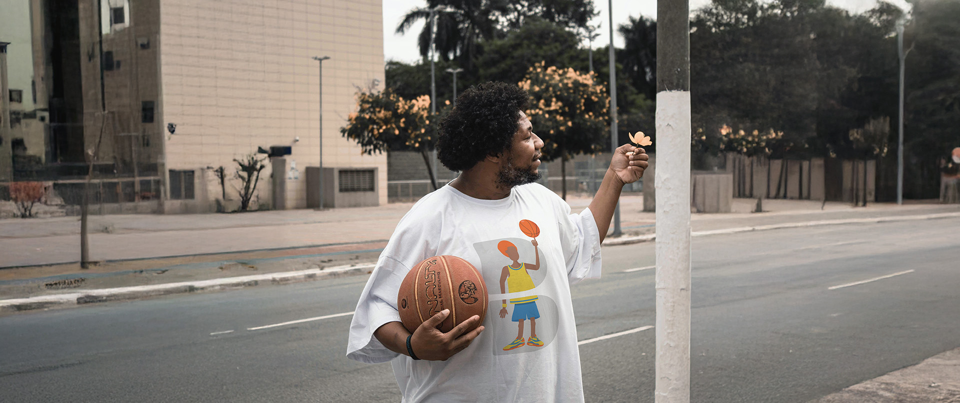 An employee wearing a DDB basketball t-shirt