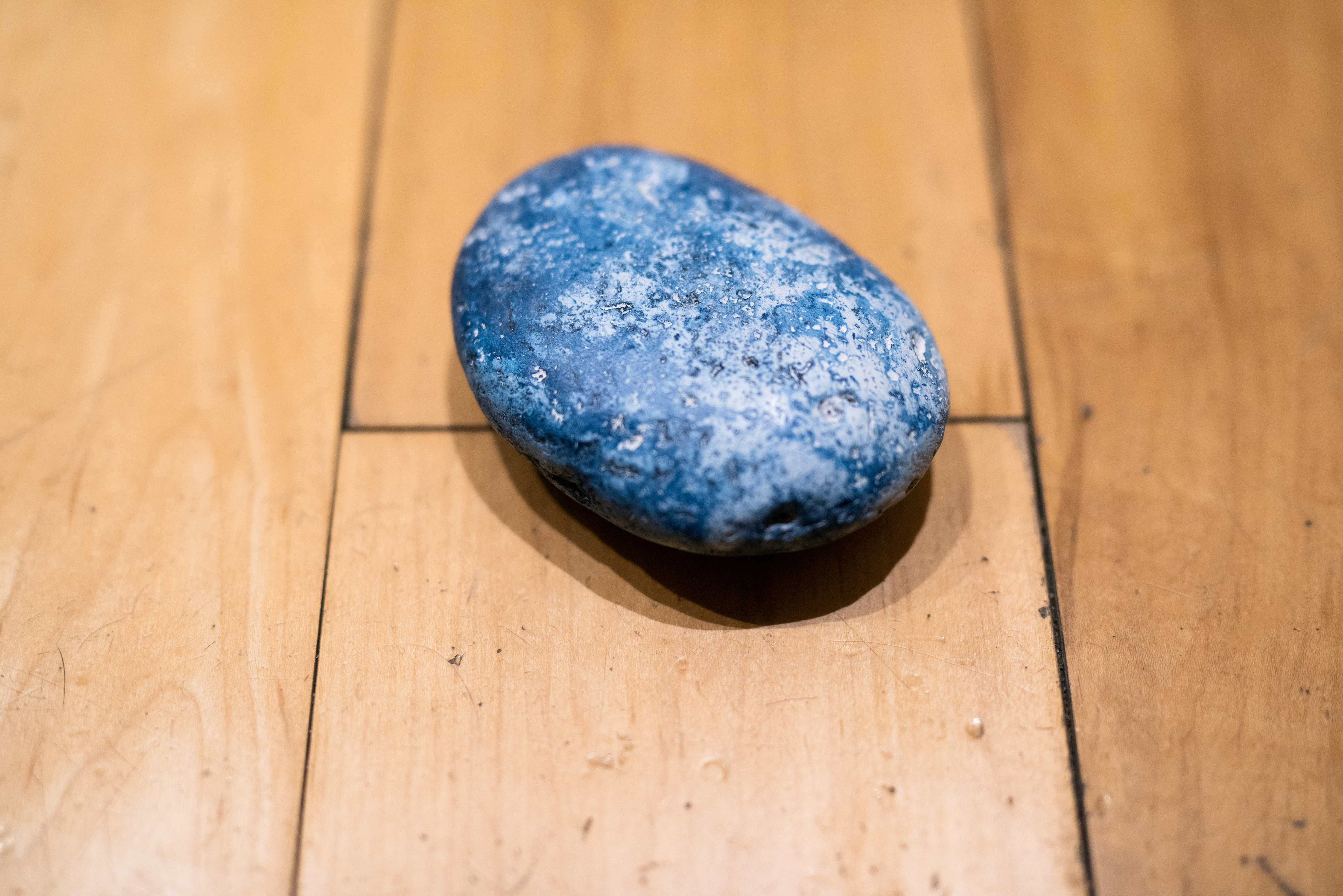 "Pool," 2021, cyanotype on painted river rocks, detail