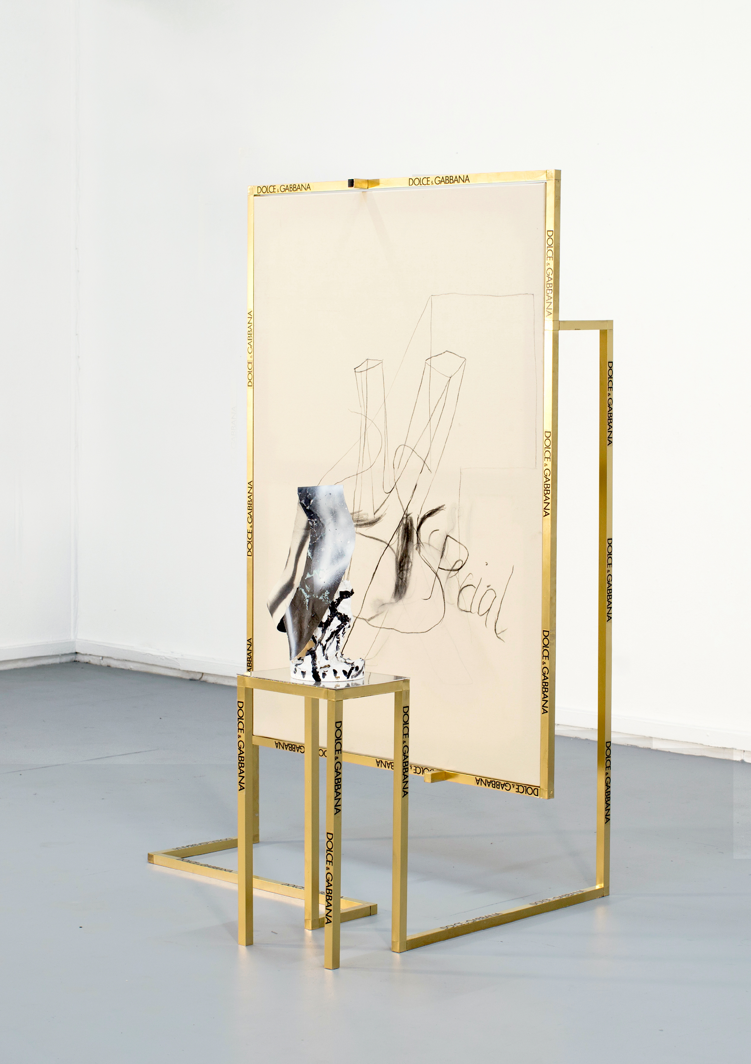 Desiring Machines (Dolce & Gabbana), 2018Brass frame. vinyl stickers, Perspex, canvas, wood, screws, plaster, spray paint, charcoal. 195cm x 112cm x 112 cm. 2018