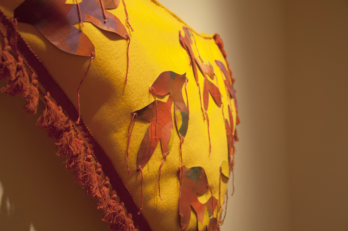 Cushion, 2019, 27" x 43" x 6", felt, painted canvas, trim, fiberfill