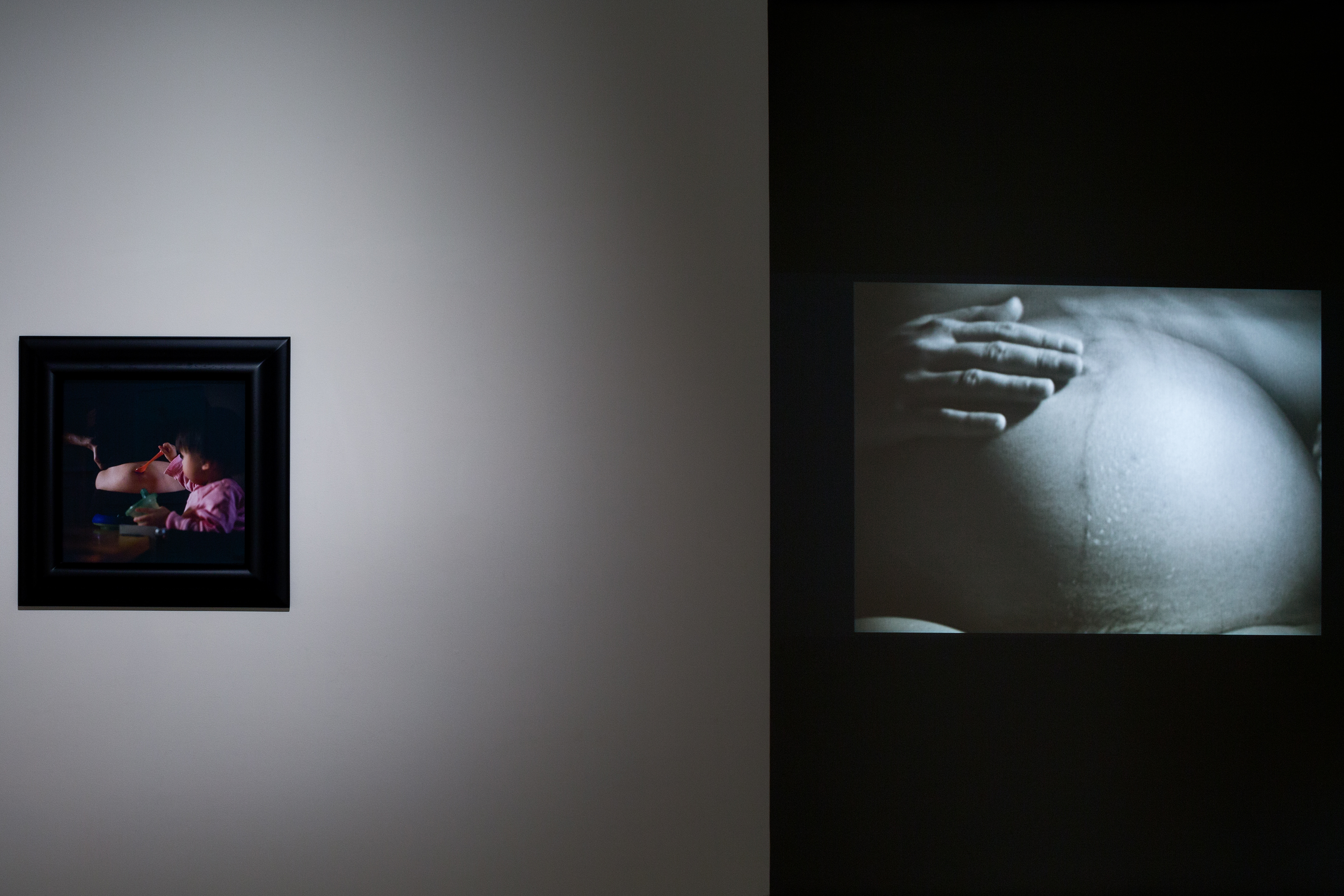   Janine Antoni, One Another,2008, digital c-print, 21 3/4 x 21 3/4 in. Mary Kelly,Antepartum, 1973; super 8 film loop transferred to video, 1:30min. (Credit Rafael Gamo.)