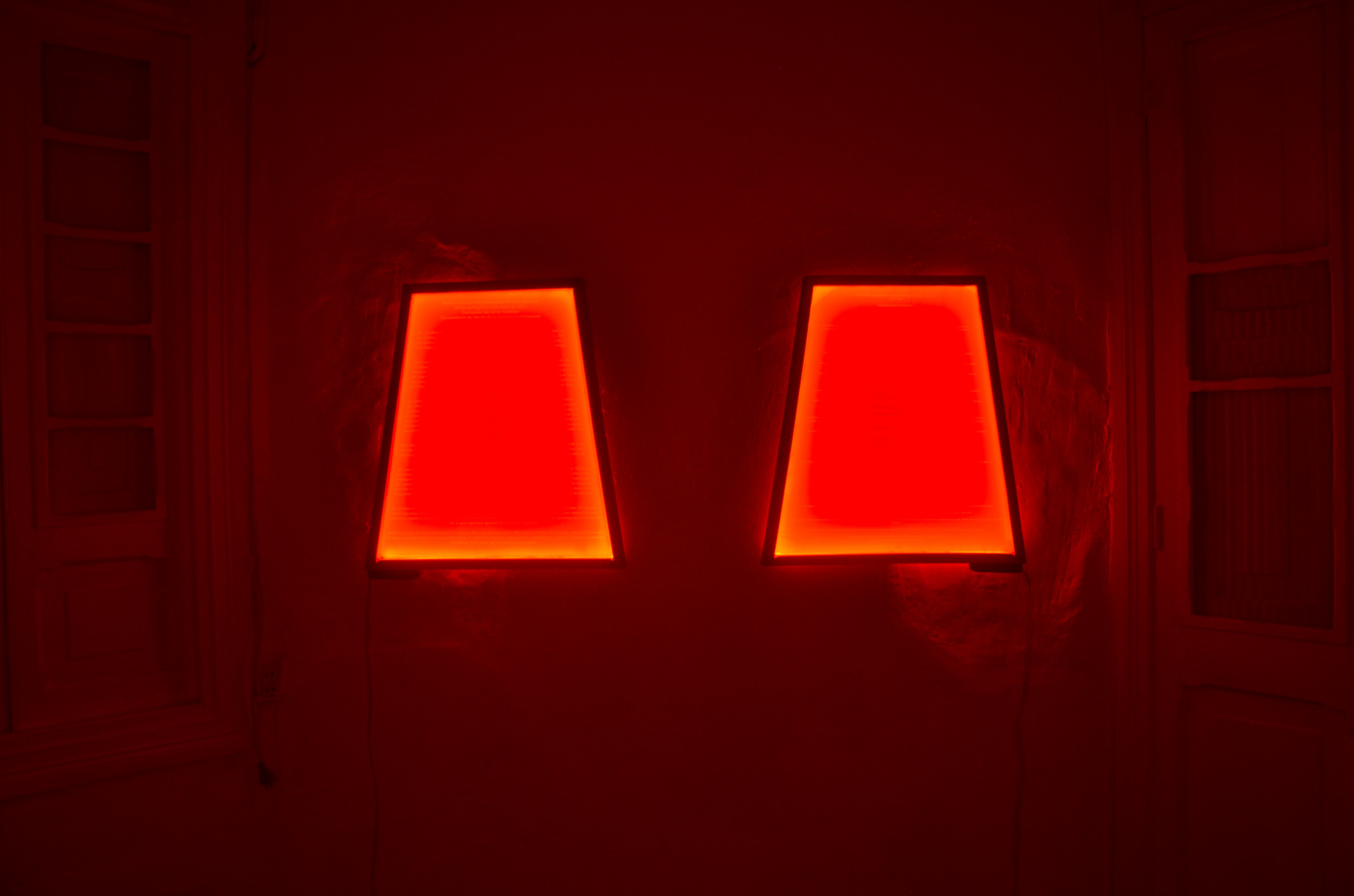 “Statements,” series of four trapezoidal screen printing plates illuminated from behind, 63.5x70cm. 2025