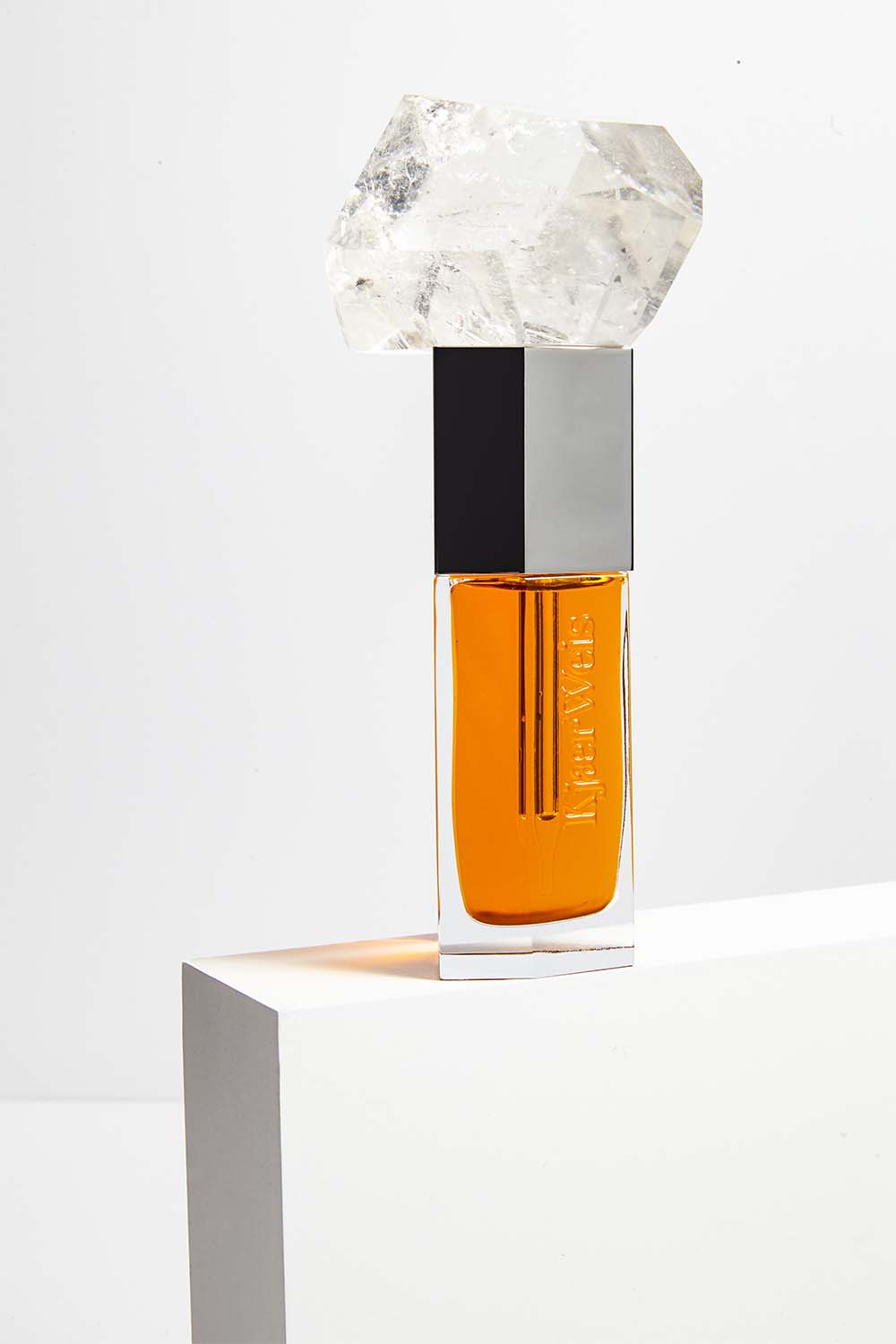 Kjaer Weis Facial Oil dynamically displayed by Texture Stylist Sara Wacksman