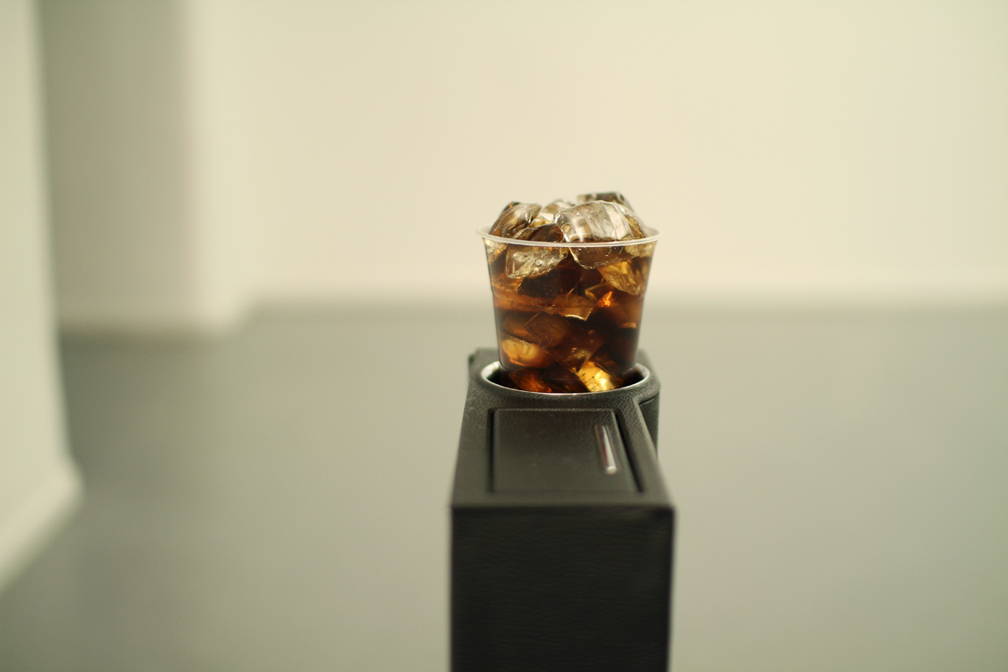 Cola & Glass, 2014, Glass cubes ,Plastic cup ,Coca-Cola, Air pump, wood stand, fabricated leather, glass stand, 77x5x14 cm