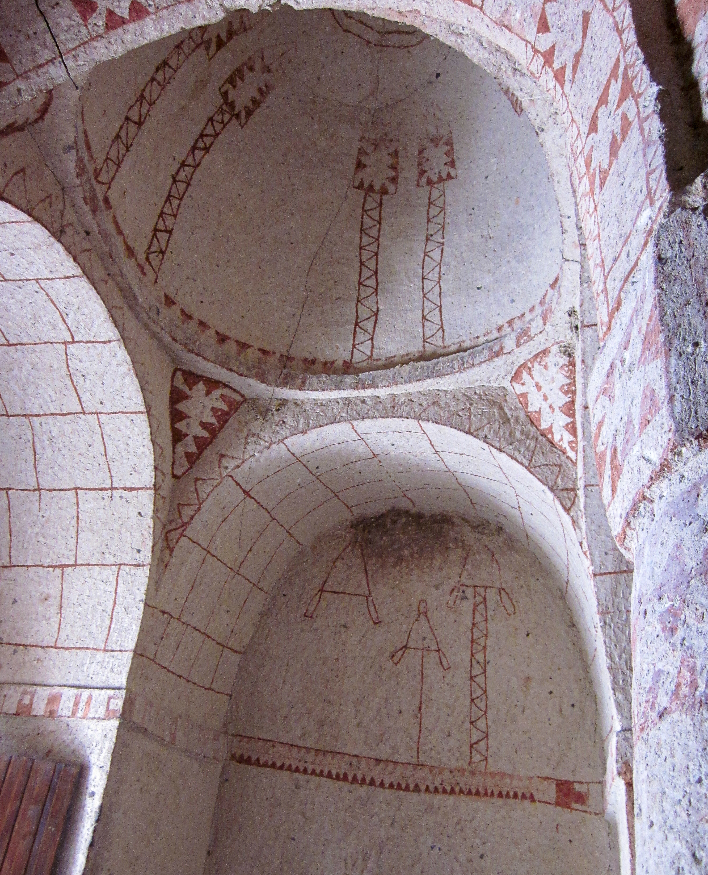 At St. Barbara Church in Göreme, masonry architectue is simulated in red linear painting that also includes folk art style decoration.