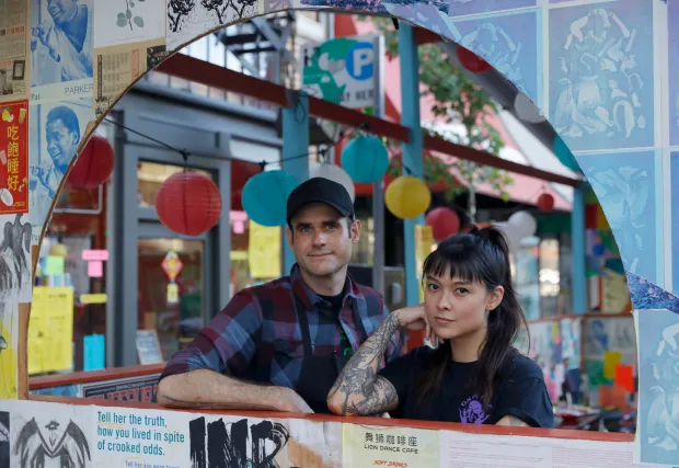 Lion Dance Cafe Parklet designed and built by CAHA. Decorated by the community. Chef/Owners of Lion Dance Cafe Shown here in our Semi Circular Window Cutout.  Photo by Jane Tyska for Mercury News.