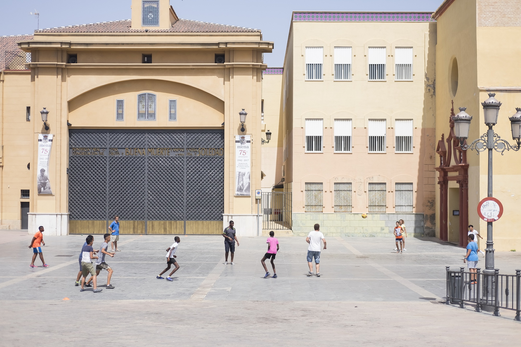 Playing football in front of Pontifical congregation of Buena Muerte, Málaga.