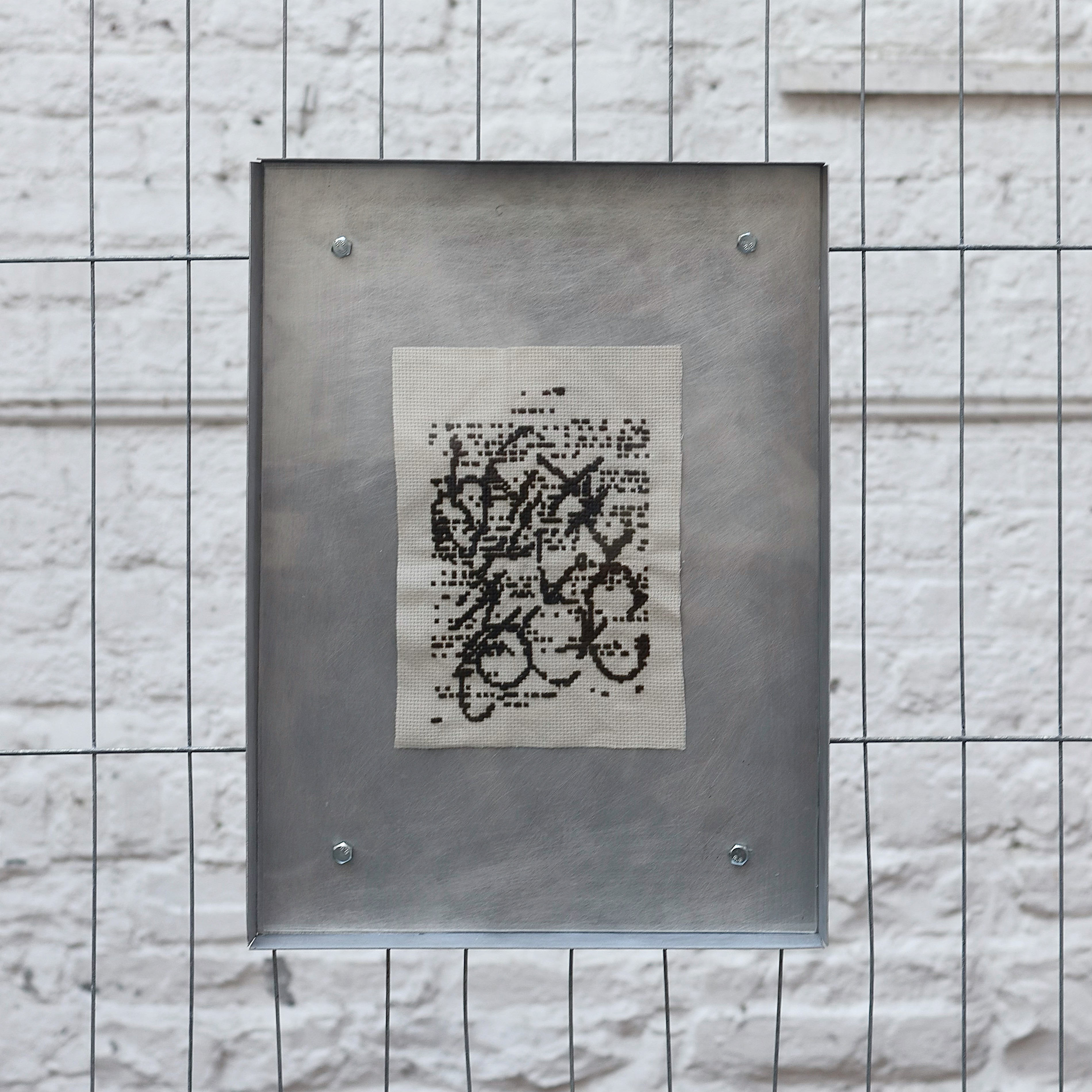 'TL;DR' (aluminum, cross stitch, acetate, nuts & bolts)