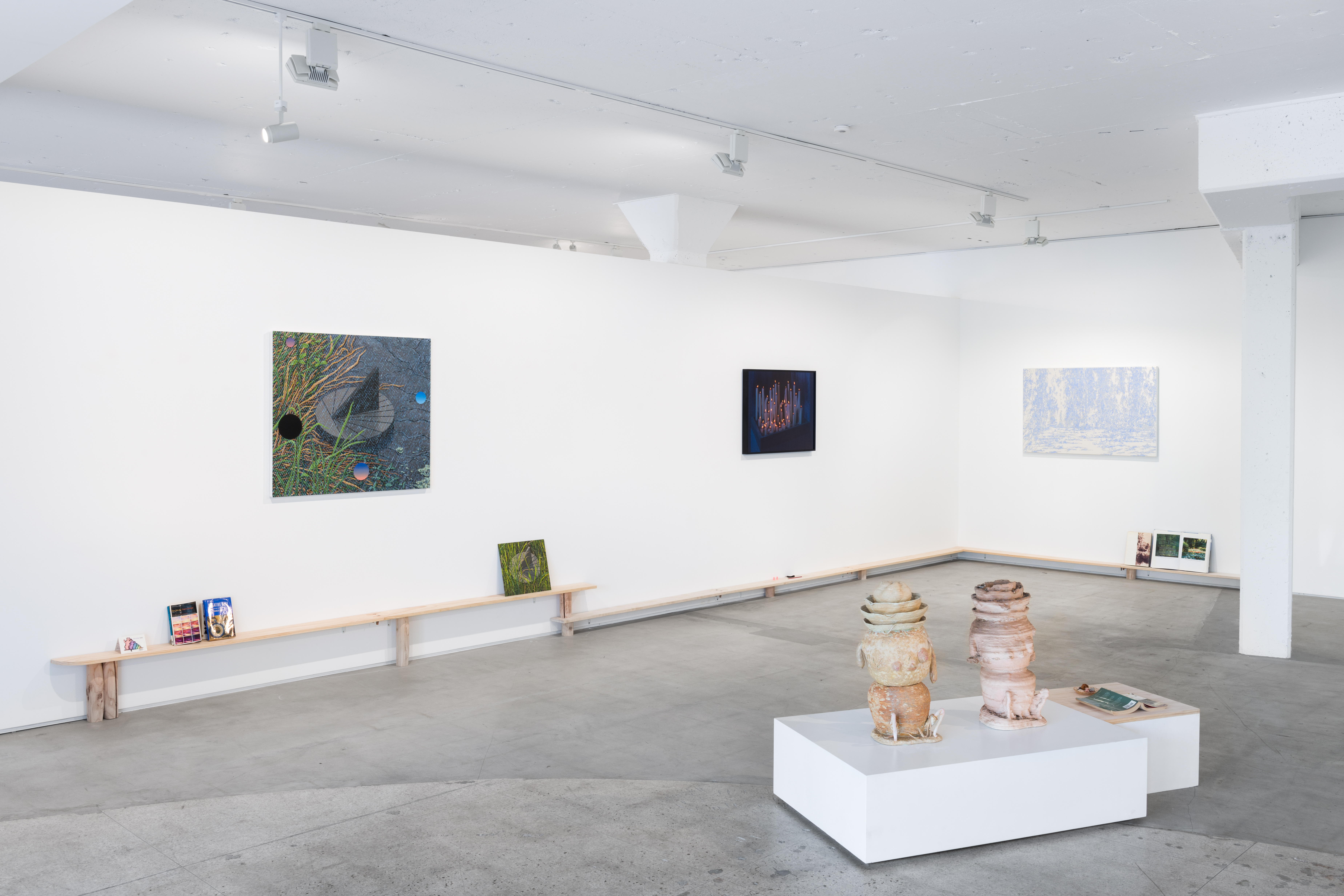 Books and Things | Installation viewAlong wall, left to right: David Aipperspach, Sundial (4), 2022 | David Aipperspach, Small Sundial, 2022 | Heather Cleary, The Evening, 2022 | KyungChul Shin, T-HERE-202293, 2022Center podium, left to right: Eun-Ha Paek, Pa/god/a (original), 2018 | Eun-Ha Paek, Ghost in the Machine, 2019
