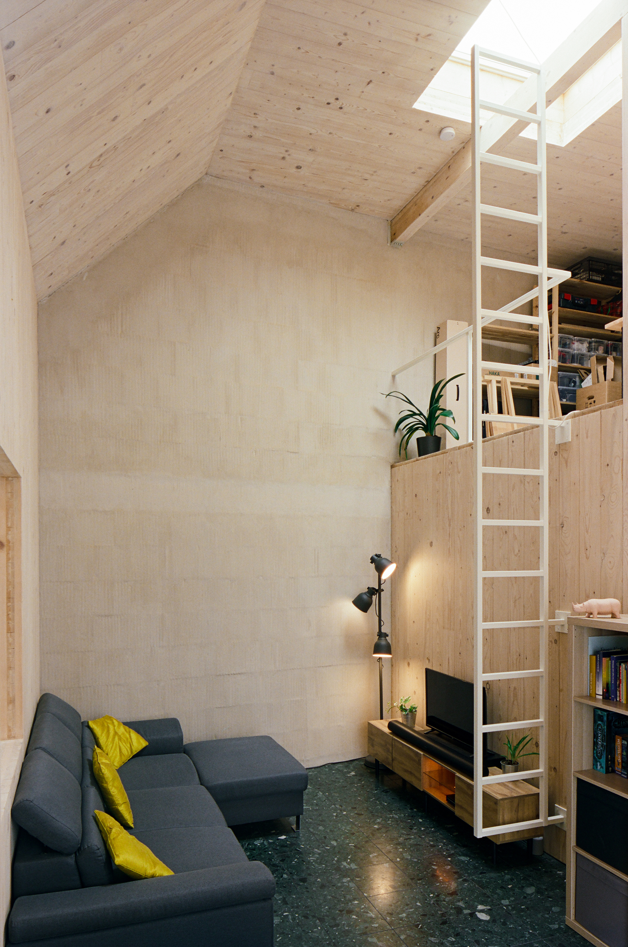 The top floor apartment is designed as a double-height space